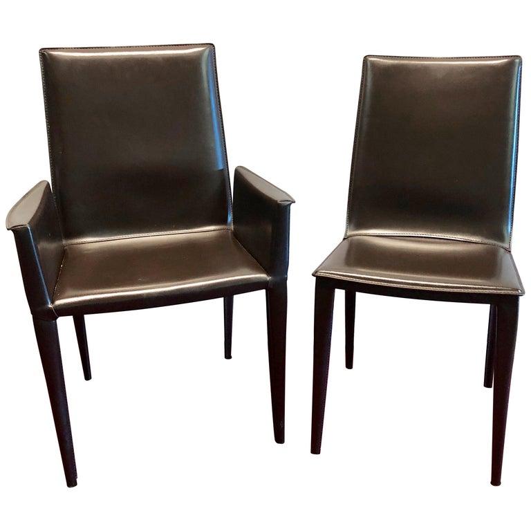 Set of 8 'Frag' Italian leather dining chairs Marchio Collettivo collection by Design Within Reach. This fine set of reclining dining chairs. Steel frame; harmonic sheet steel back; birch plywood seat; tapered tubular steel legs; polyurethane foam