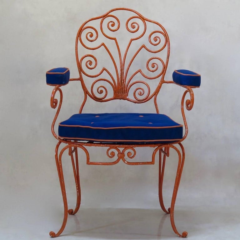 This set of eight wrought-iron armchairs is of beautiful quality and design, presenting a 1940s interpretation of the Louis XV style. The shield backs are gently curved and have a pretty, scrolled pattern within. The wide seats are raised on