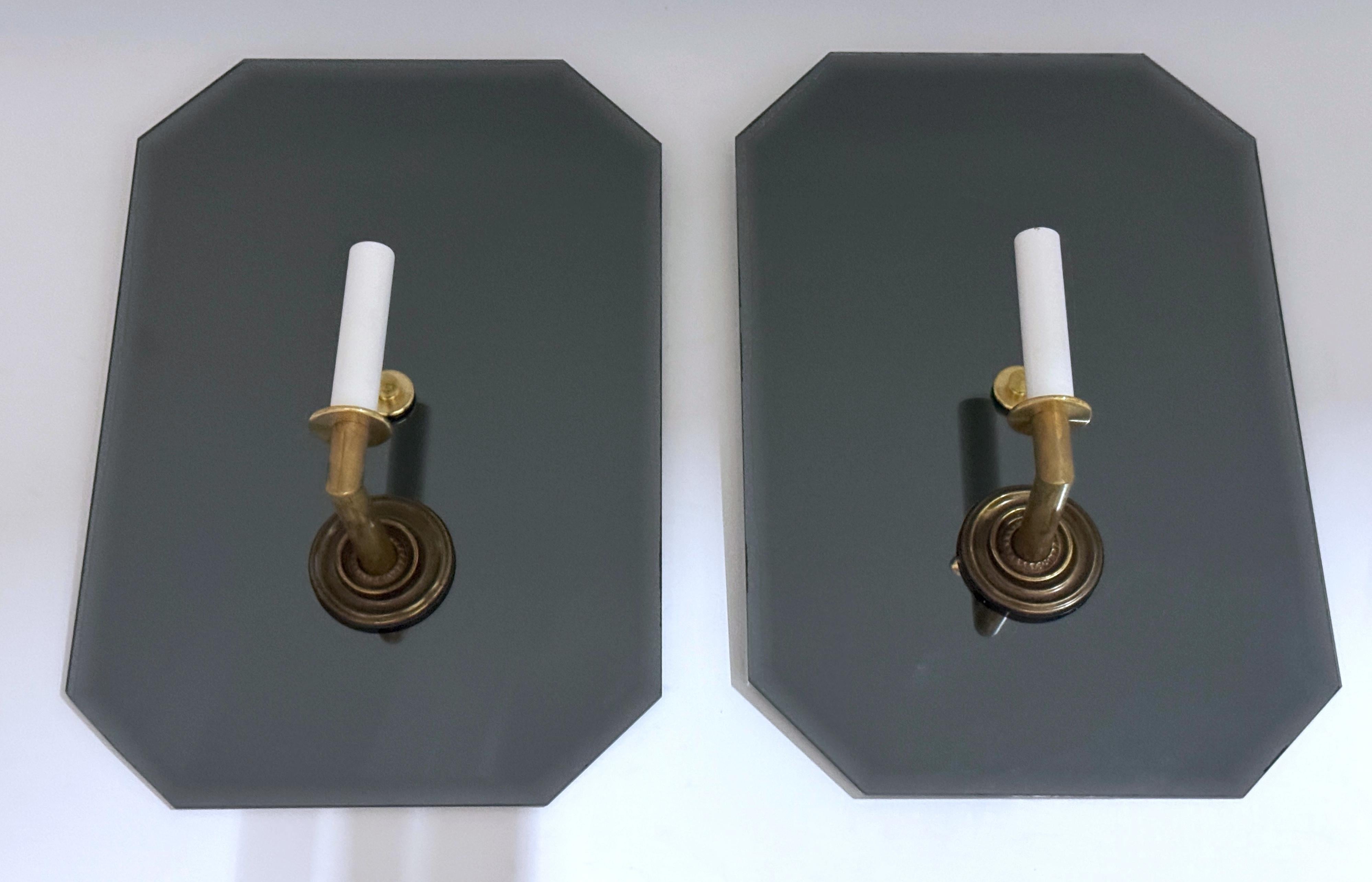 8 French Modern Maison Janson Atrib. Mirror and Bronze Wall Sconces, Sold in Pairs 
Four pairs are currently available.
France, circa 1960s

The timeless elegance of French modern design is reflected in these exquisite Maison Janson-attributed wall
