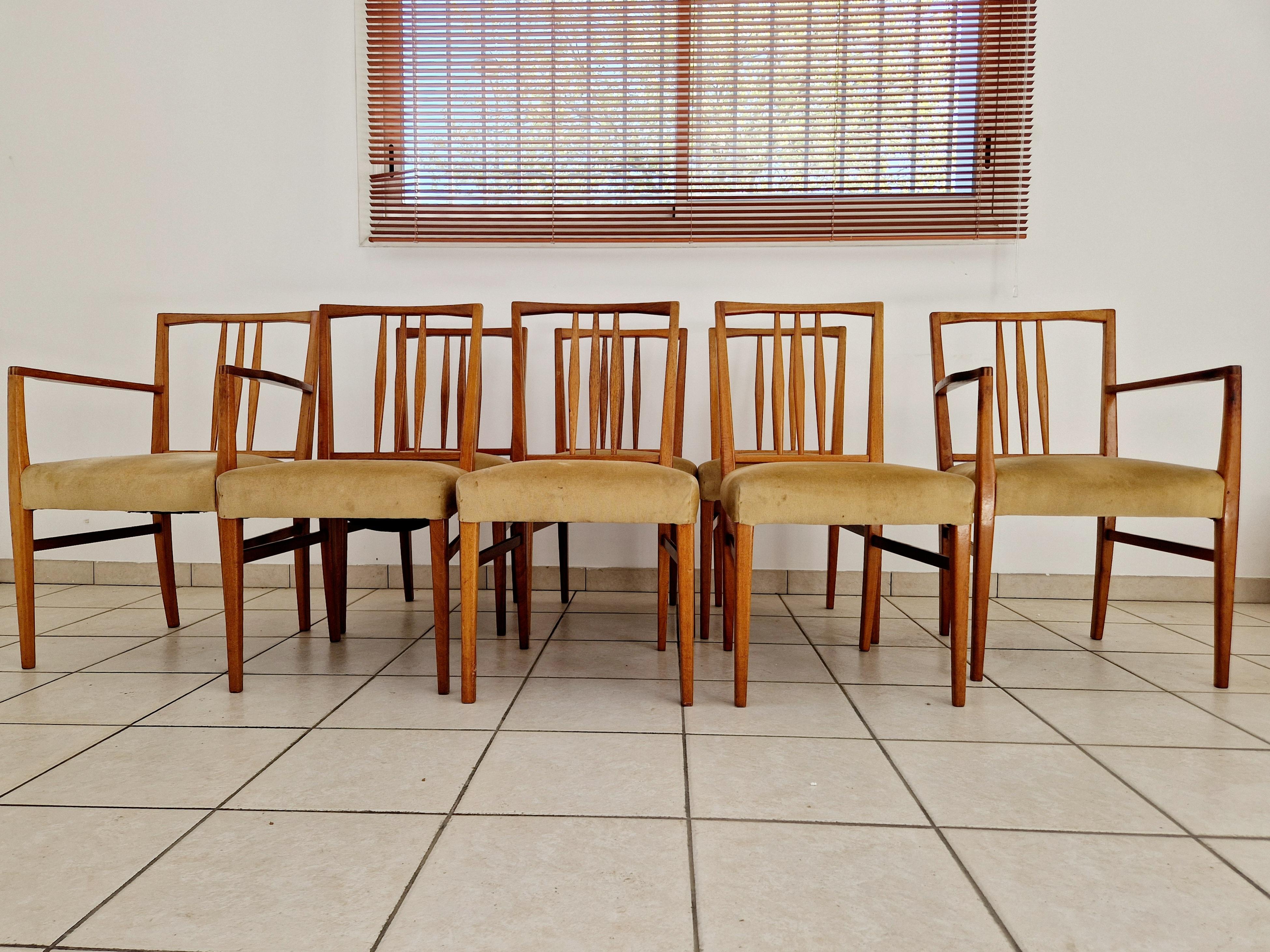 Crafted in the heart of the United Kingdom, this set of eight Gordon Russell dining chairs is a true emblem of Mid-Century Modernism. Made with the finest teak, each piece stands at a proud 86 cm in height, with a comfortable seat height of 45 cm,
