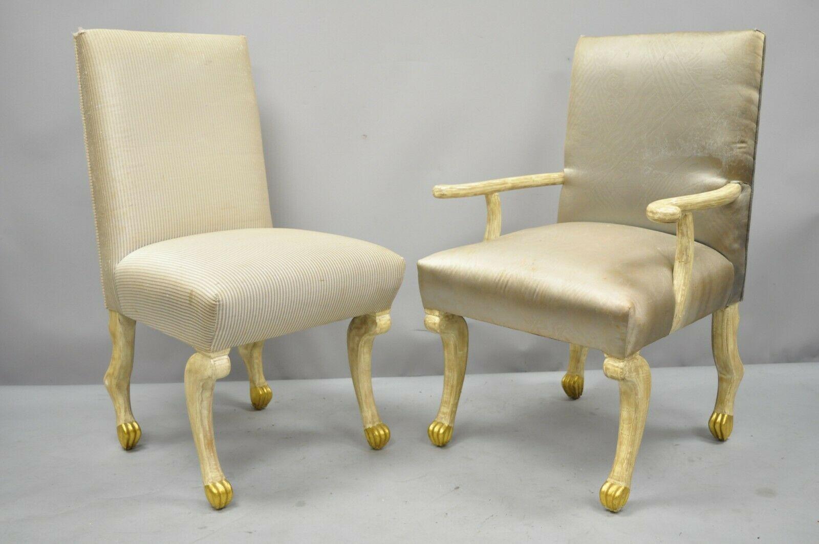 8 hoof paw foot Regency style dining chairs after the Etruscan chair by John Dickinson. Listing includes (2) Armchairs, (6) side chairs, cream and gold gilt distressed finish, hoof or paw feet and legs, solid wood frame, upholstered seat, great