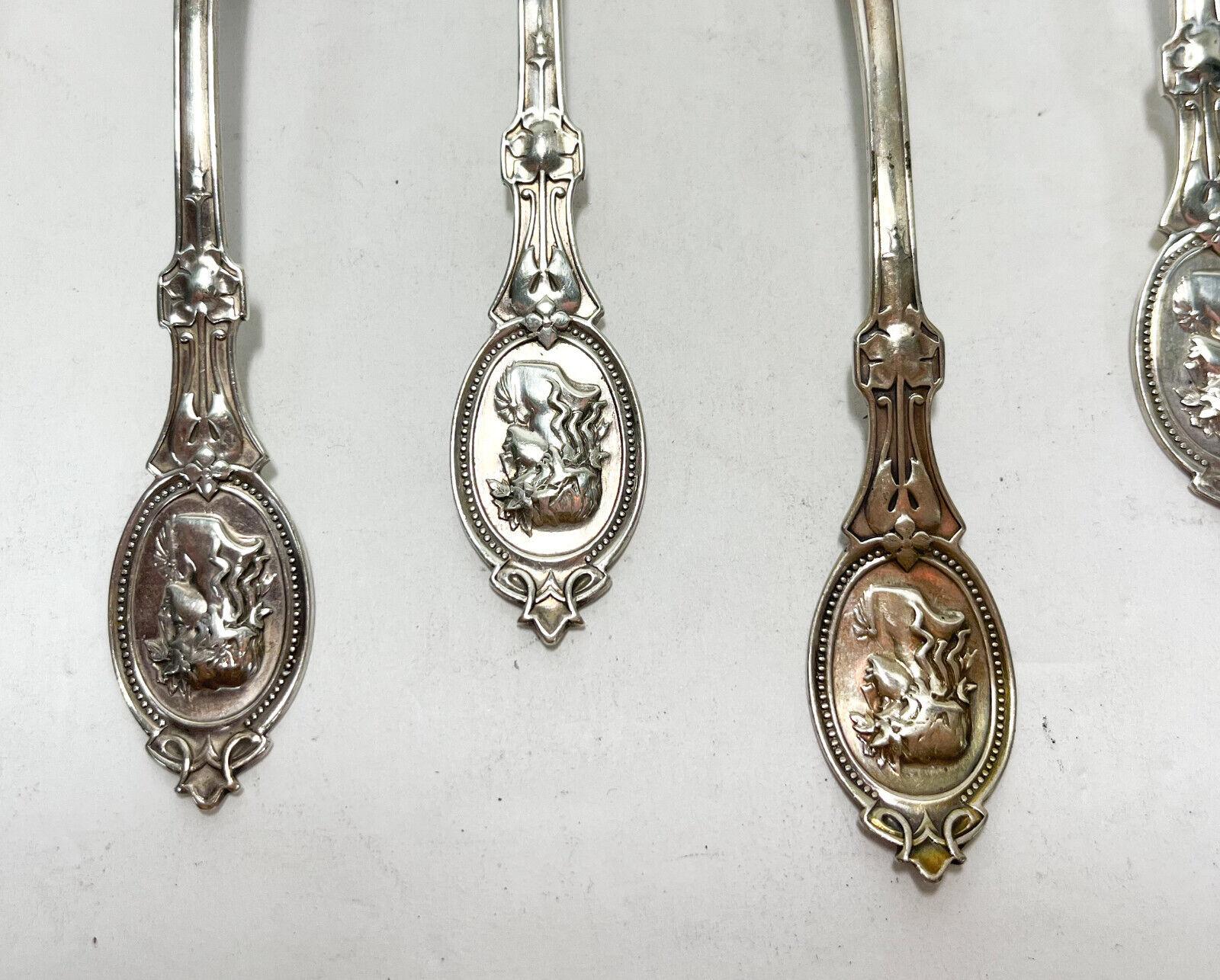 8 Hotchkiss & Schreuder sterling silver medallion grapefruit spoons, Late 19th Century. Etched flowers with an etched warrior figure to the finial. Hotchkiss & Schreuder hallmark to the verso handle.

Additional Information: 
Type: Grapefruit