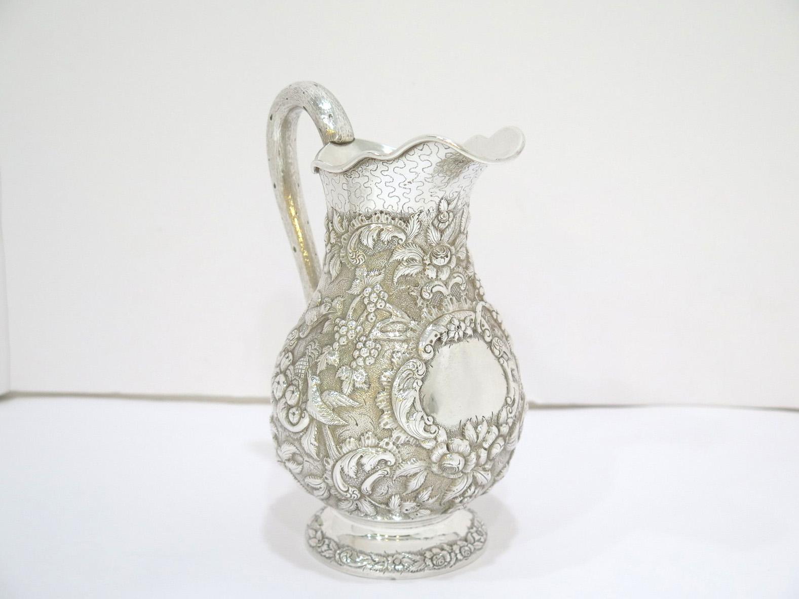 American Coin Silver A. E. Warner Antique Birds Flowers Repousse Small Pitcher For Sale