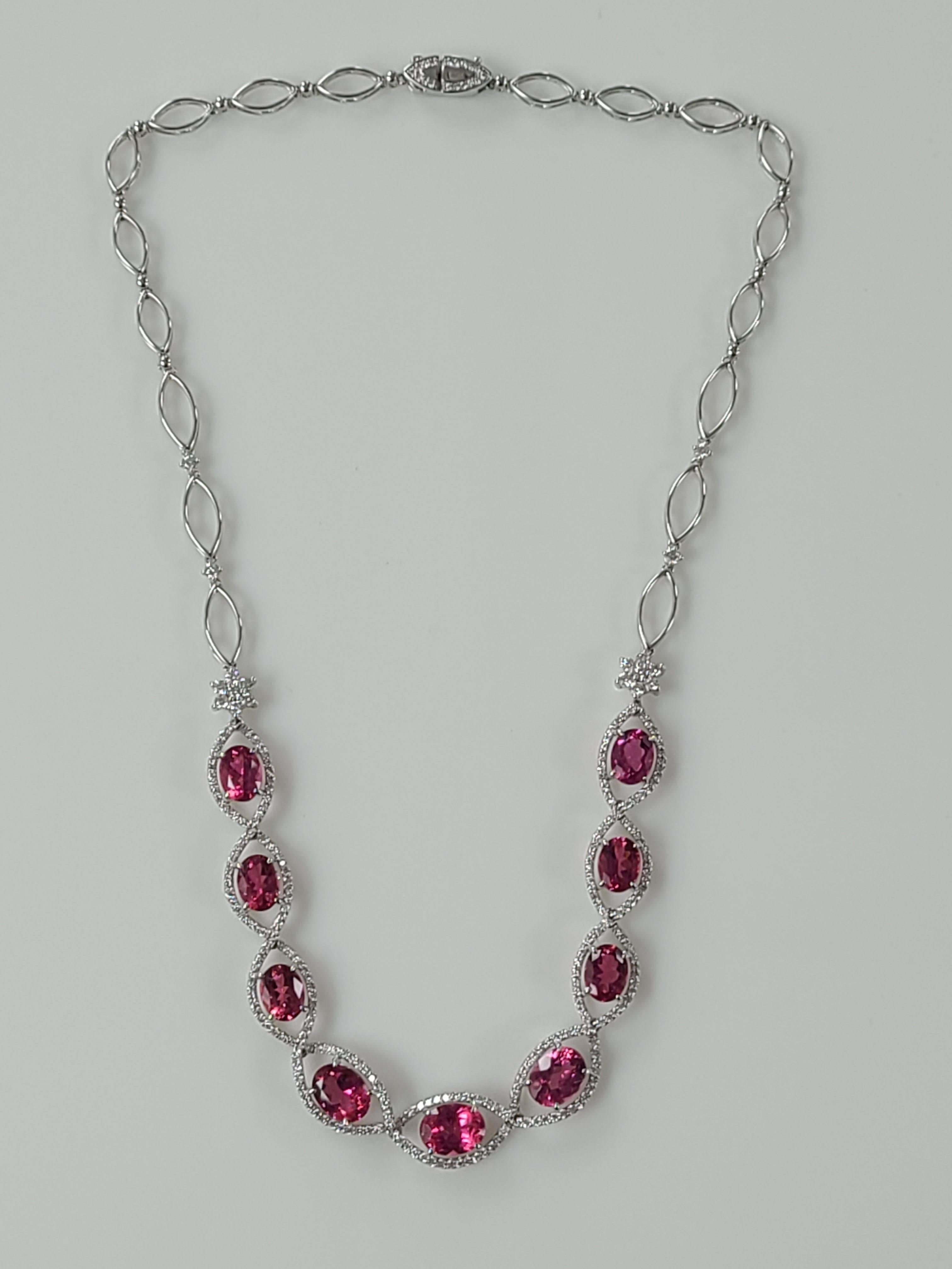A Gorgeous Tourmaline necklace set in 18K White Gold with diamonds . The tourmalines are beautiful Pink colour with Superior cutting and weight about 12.19 carats and diamond weight is 2.4 carats. The necklace dimensions in cm 20 x 1 x .5 (LXWXD).