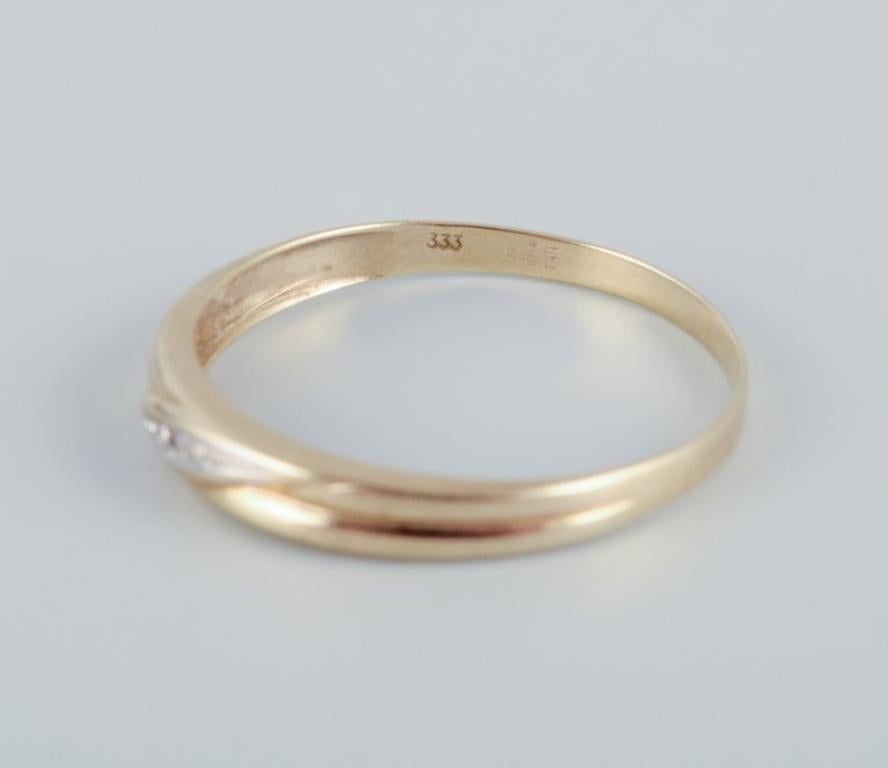 Women's 8-karat gold ring adorned with small diamonds. Modernist design For Sale