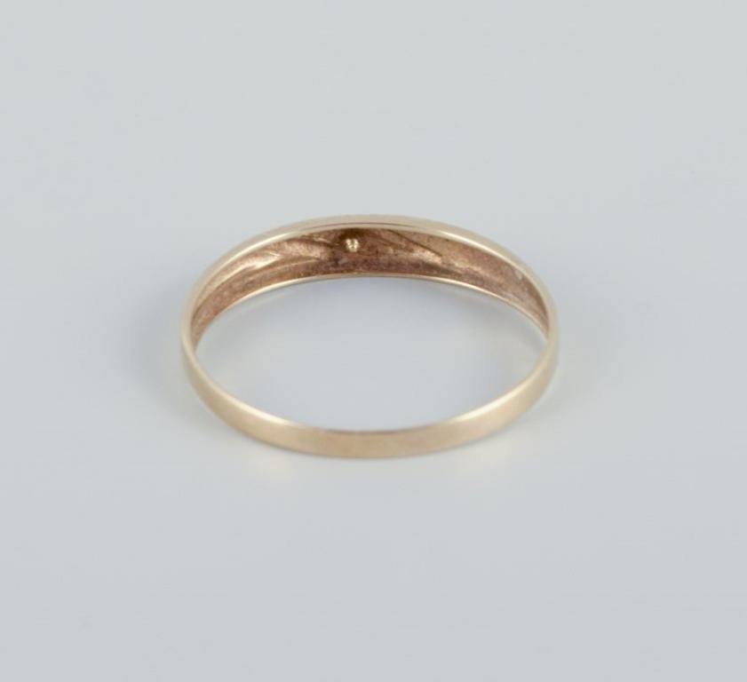 8-karat gold ring adorned with small diamonds. Modernist design For Sale 1