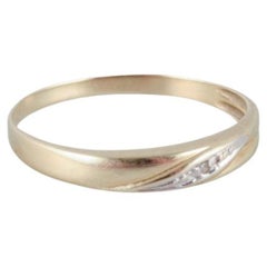 Vintage 8-karat gold ring adorned with small diamonds. Modernist design