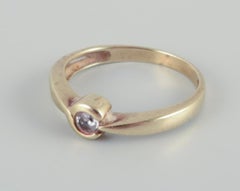8-karat gold ring with a small diamond. Modernist design. Mid-20th C.