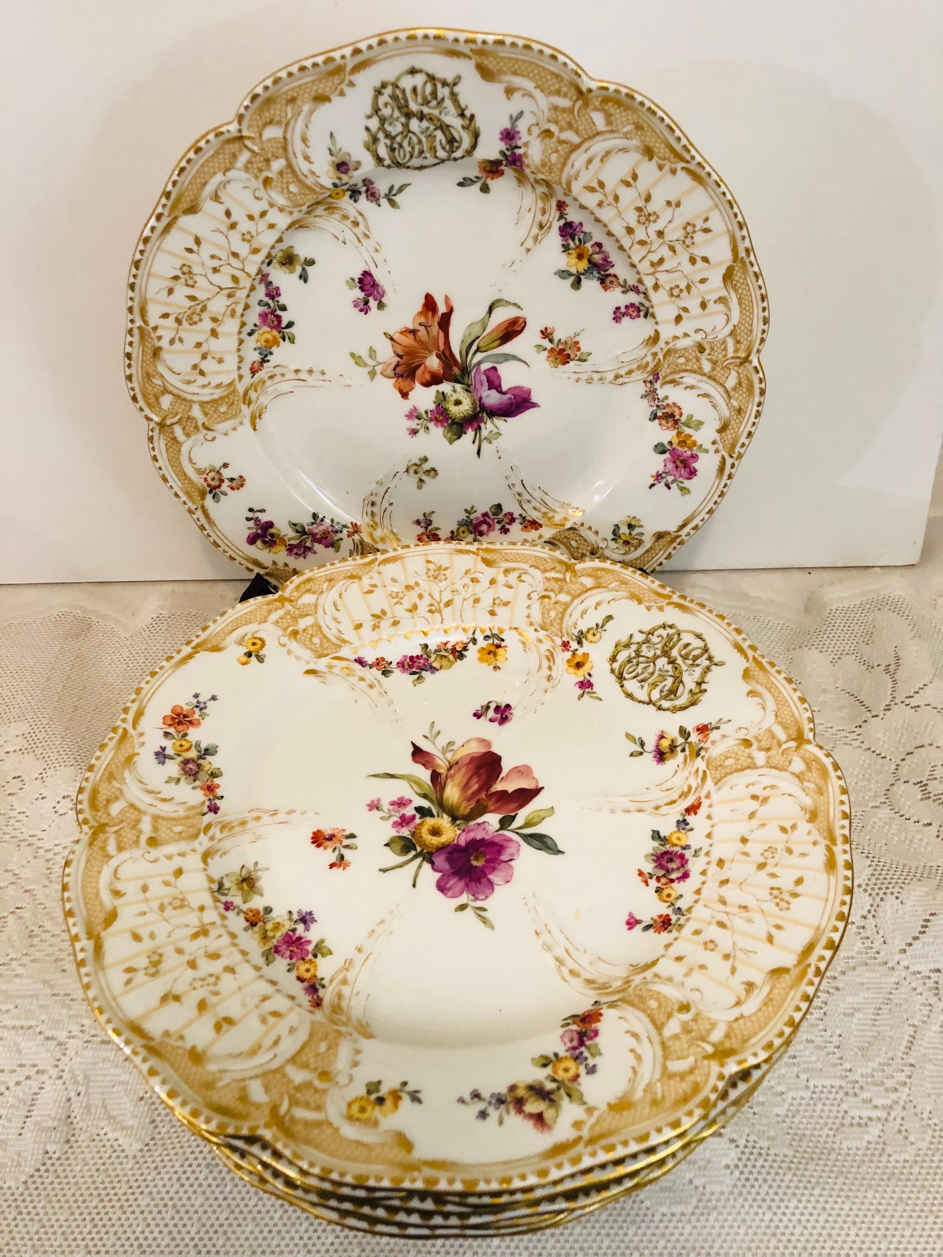 This set of KPM plates and bowls is painted in the manner of the first Potsdam Service made for the palace of Friedrich the Second, (1712-1786), who founded KPM porcelain in 1763. It includes eight dinner plates and six wide rim soup bowls. The