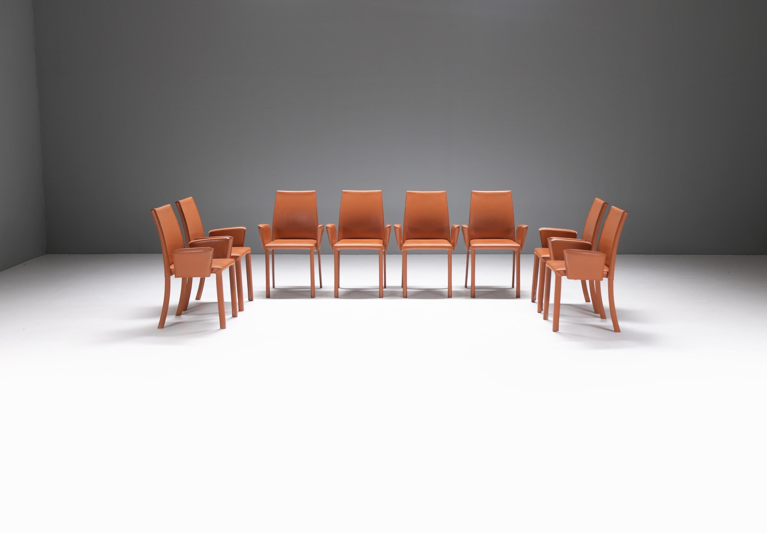 Elegant & comfortable Bottega armchairs in cognac/orange leather.
Designed by Renzo Fauciglietti and Graziella Bianchi for FRAG Italy in 2003

The frame structure is a harmonic sheet steel back that flexes with you for continuous support. Wrapped in