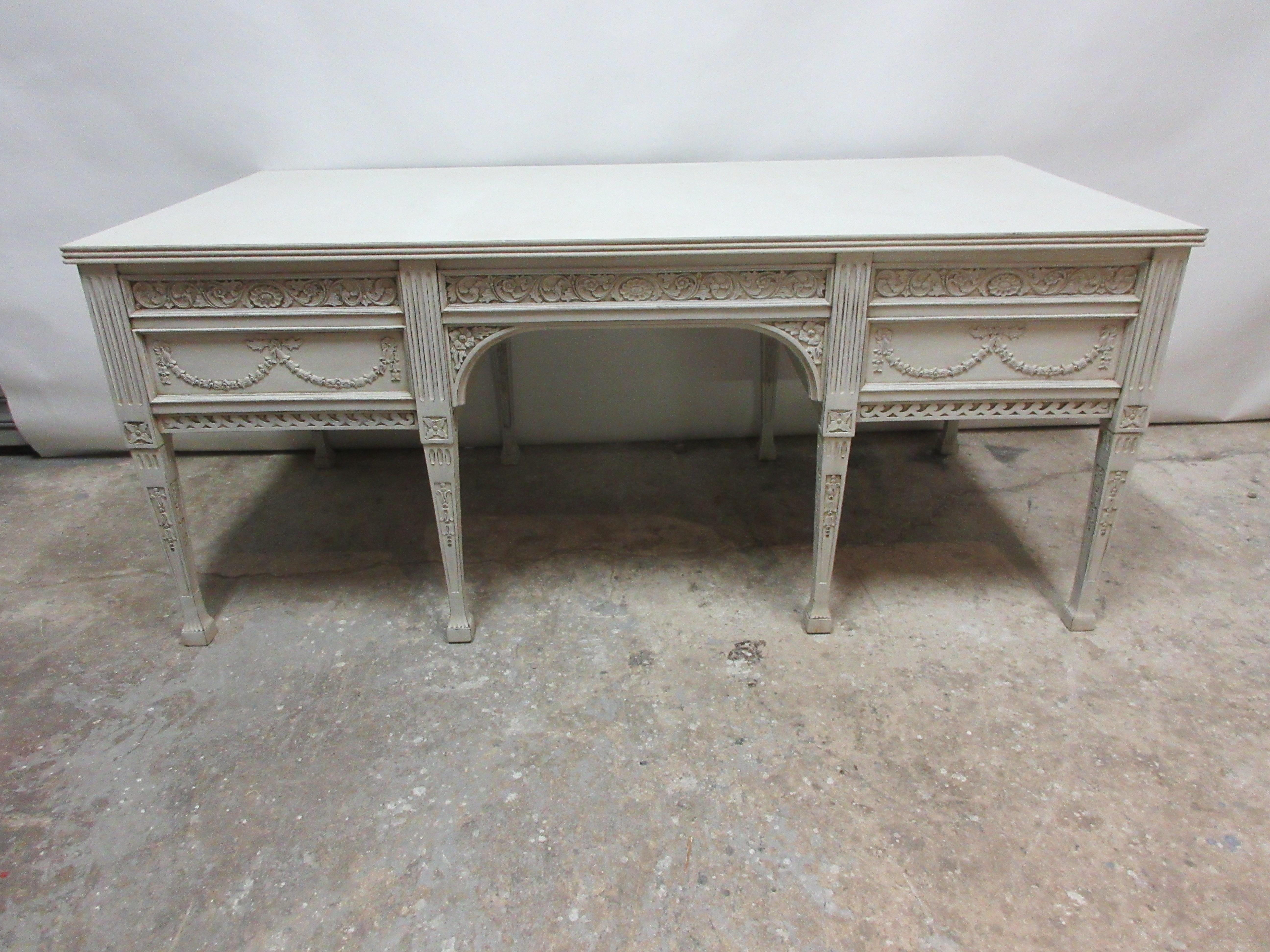 This is an 8 leg Gustavian Style carved desk , its restored and repainted with milk paints 