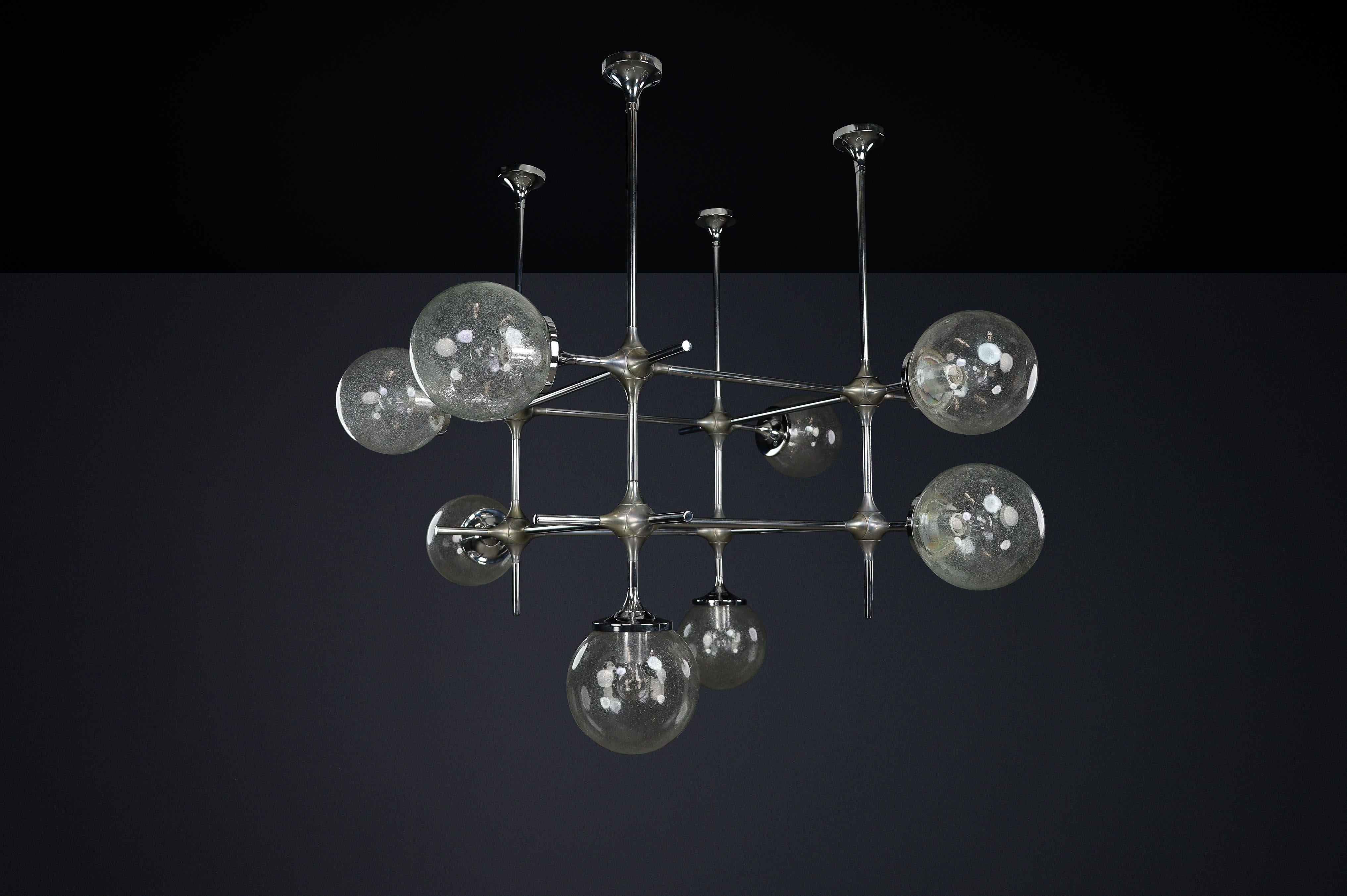 Raro apparecchio modulare a 8 luci di Peter Rockel proveniente dal Palazzo della Repubblica, Berlino Est (1975)

Questo raro lampadario modulare a 8 luci è stato progettato da Peter Rockel nel 1975 per il Palazzo della Repubblica di Peter Berlin, un