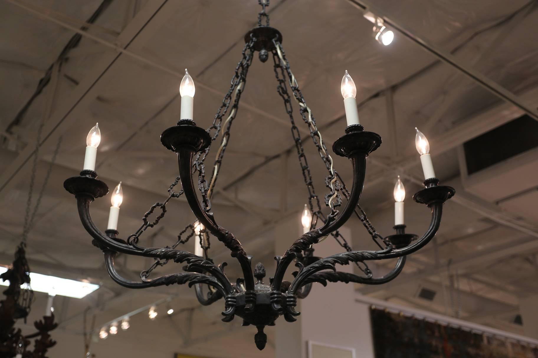 Eight-light pewter chandelier supported by a series of four chains, Italy.