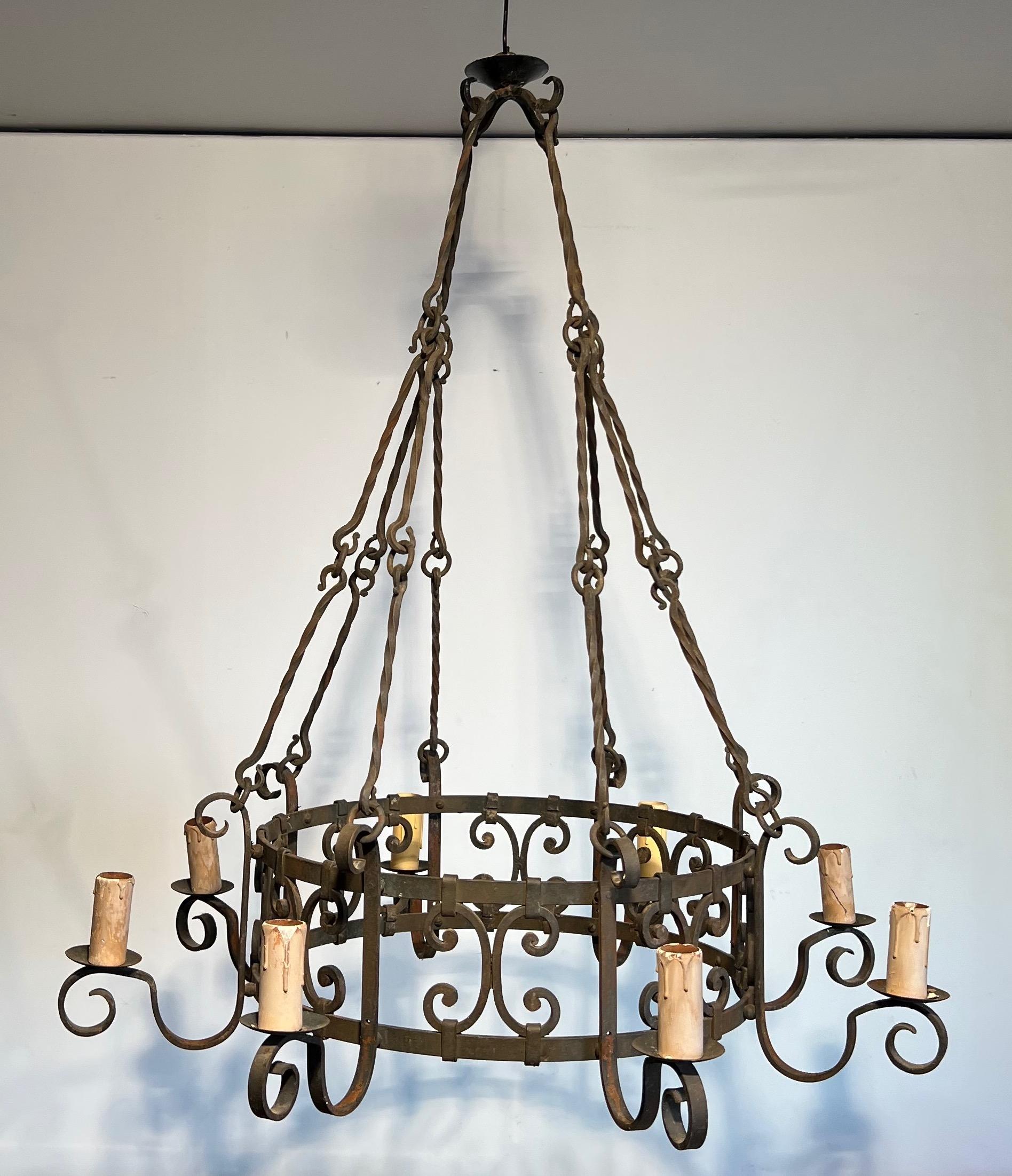 8 lights wrought iron chandelier. French work in the Gothic style. Circa 1950 11