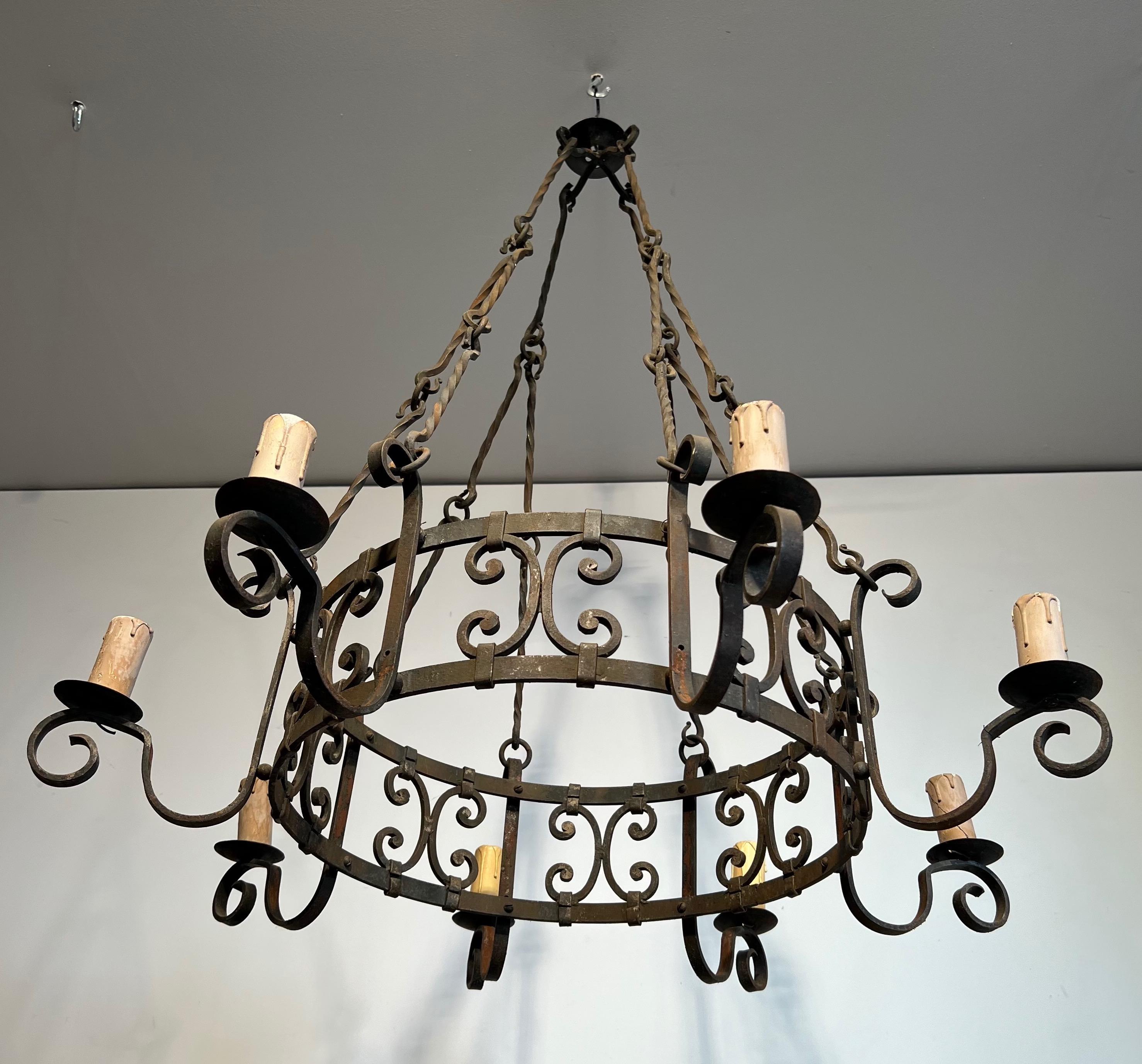 8 lights wrought iron chandelier. French work in the Gothic style. Circa 1950 In Fair Condition In Marcq-en-Barœul, Hauts-de-France