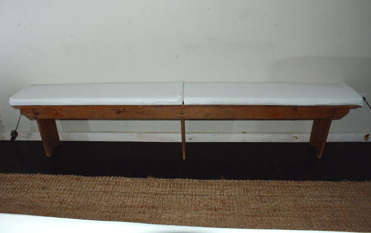 19th century antique bench extending approximately 8 feet in length, three board legs. Beautiful rustic patina, showing character from it's prior paint, stain, use and age. Great way to add a bit of casual-ease and comfort to any living space. Good
