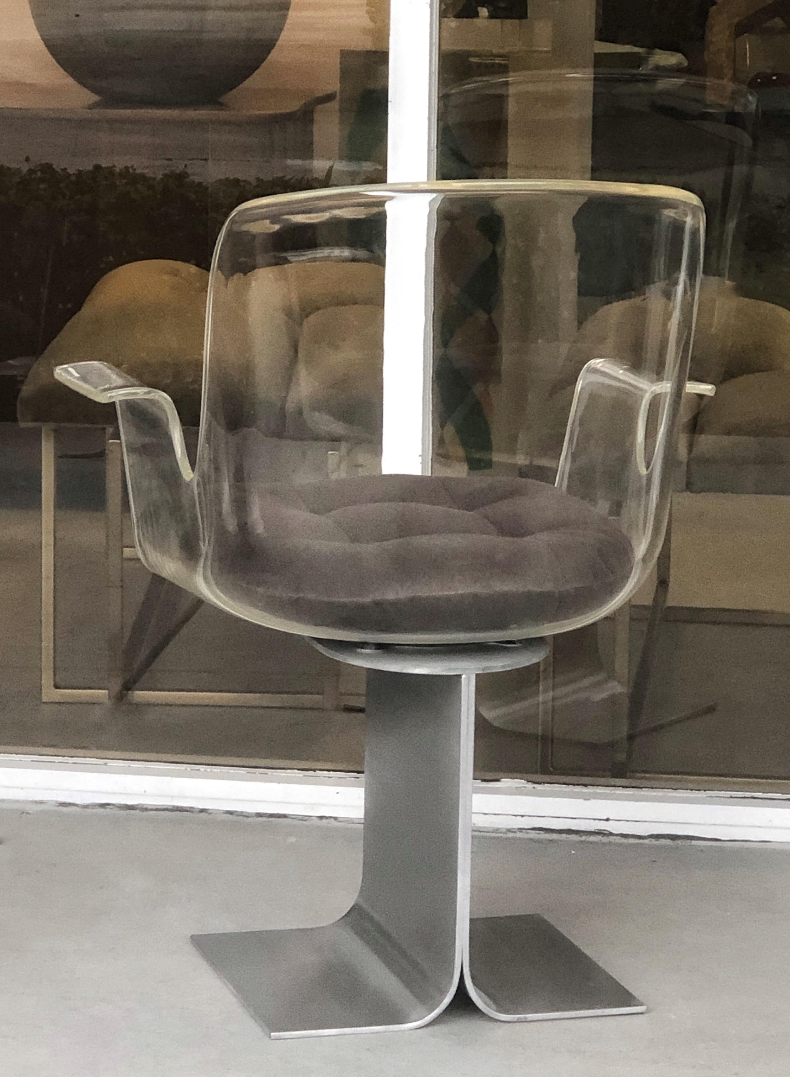 A set of 8 modern swivel arm chairs. These chairs are super versatile, and could have multiple purposes, all are arm chairs and also swivel. The tulip seats rest on a Minimalist metal base that has a brushed finish. New velvet upholstered cushions