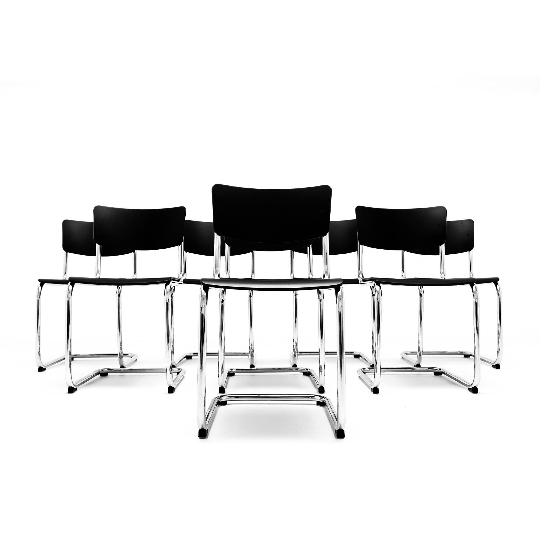 A set of 8 Mart Stam Bauhaus designed S 43 Cantilever chairs by Thonet with chrome frames and black stained beech back rest and seat. The price listed is for the 8 chairs as shown.  

The S43 chair was designed by Dutch architect Mart Stam in the