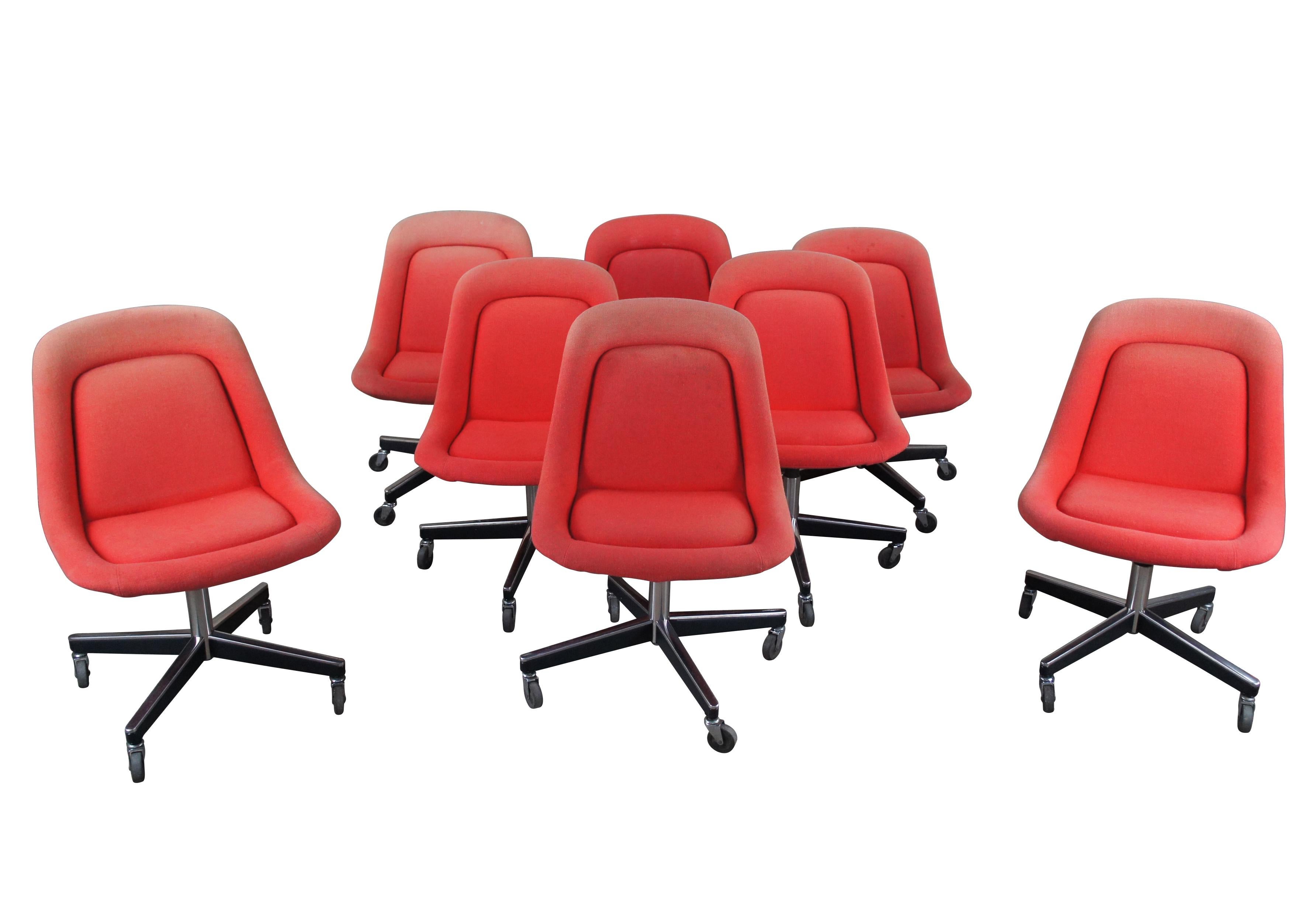 8 Max Pearson for Knoll International red wool upholstered rolling swivel chairs, circa 1960s. Great for conference table or dining use. Tulip shaped padded seats over steel swivel rolling base. marked along underside.

Introduced in 1966, the
