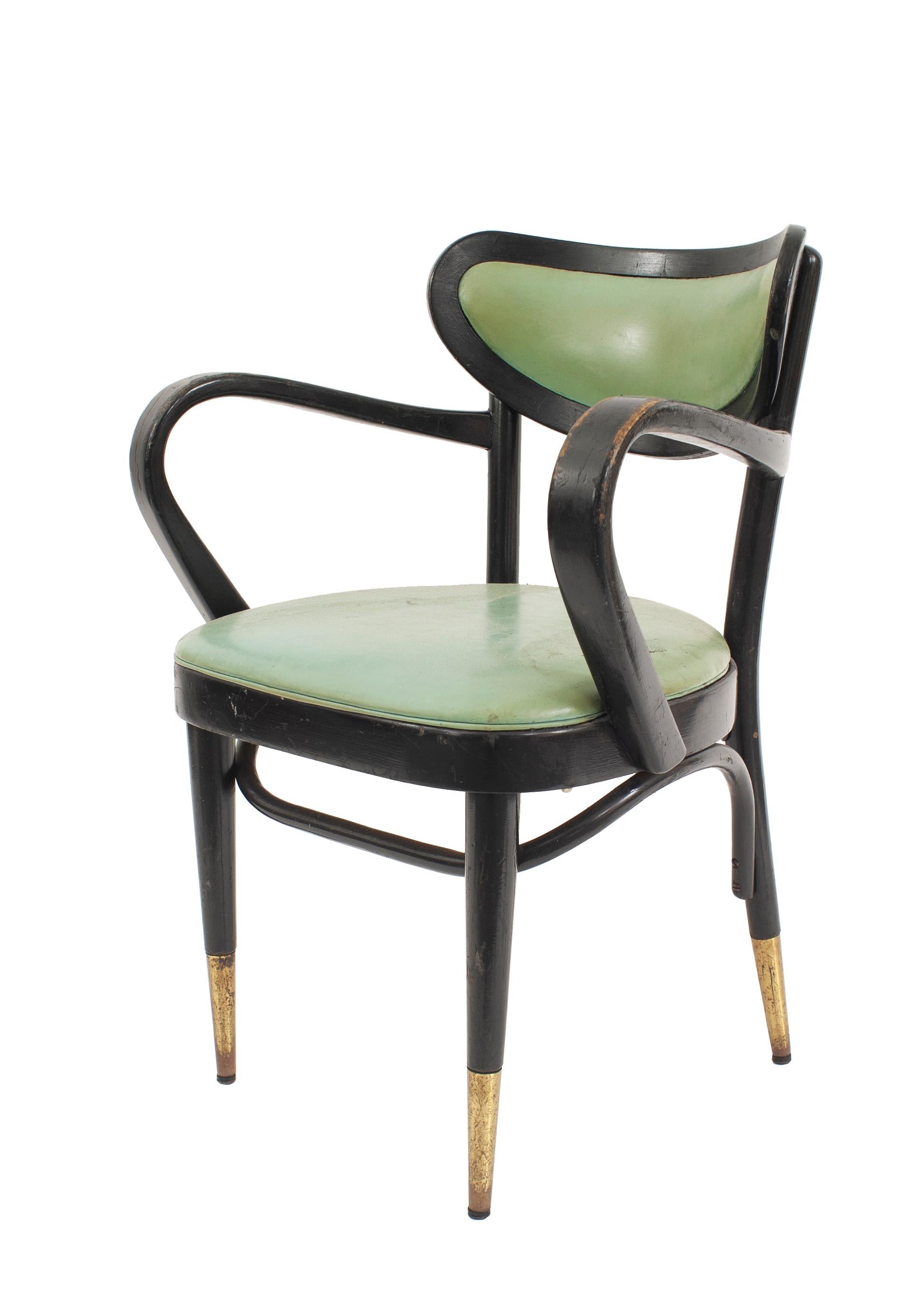 8 mid-century Bentwood side chairs having black painted frames with bowed arms & backs, green leather upholstery & brass leg sabots (priced each).
      