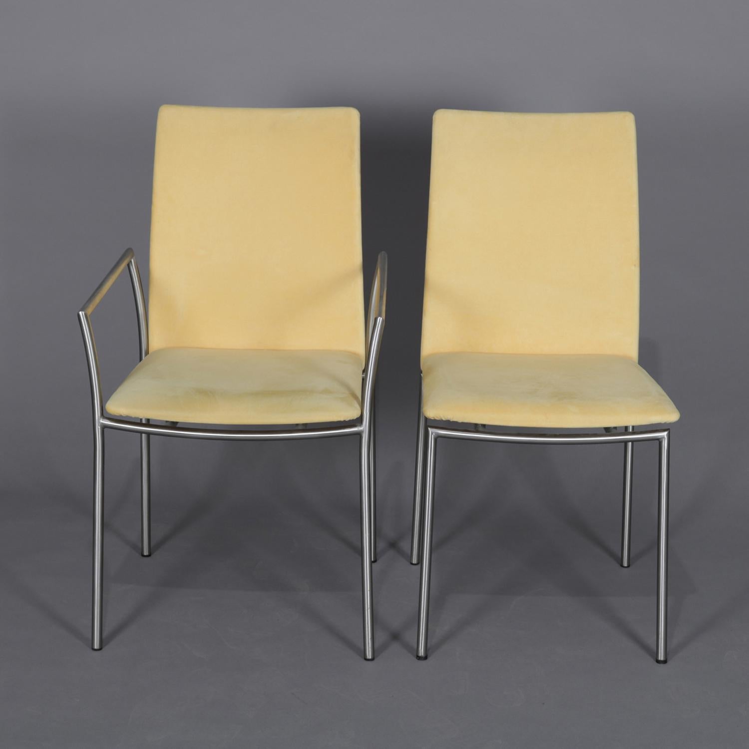 A set of eight Danish Mid-Century Modern Minimalist dining chairs by Skovby feature chrome frames with upholstered seats and backs, set includes two armchairs and six side chairs, en verso original label, 20th century.

Measures: armchairs 21