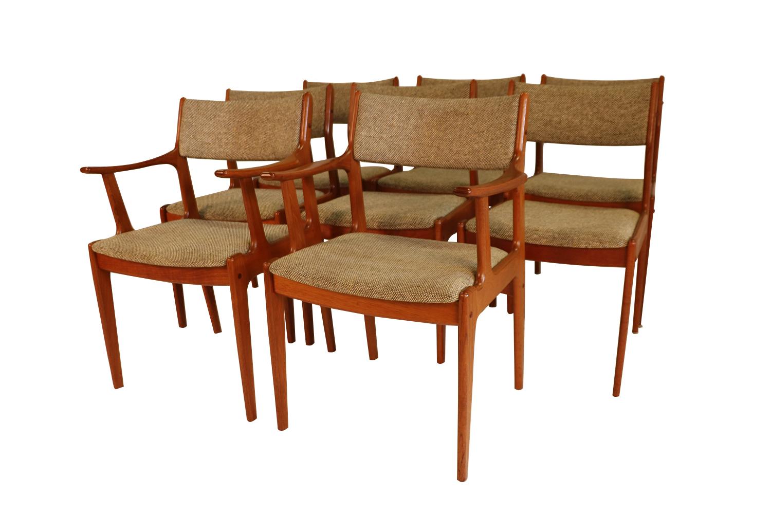 A set of eight, extremely sought after, gorgeous 1960s, modern teak side/dining chairs by the Scandinavia Woodworks Co., made in Singapore. A full matching set of 8, 2 of which have arms, remains in original condition throughout. Features teak