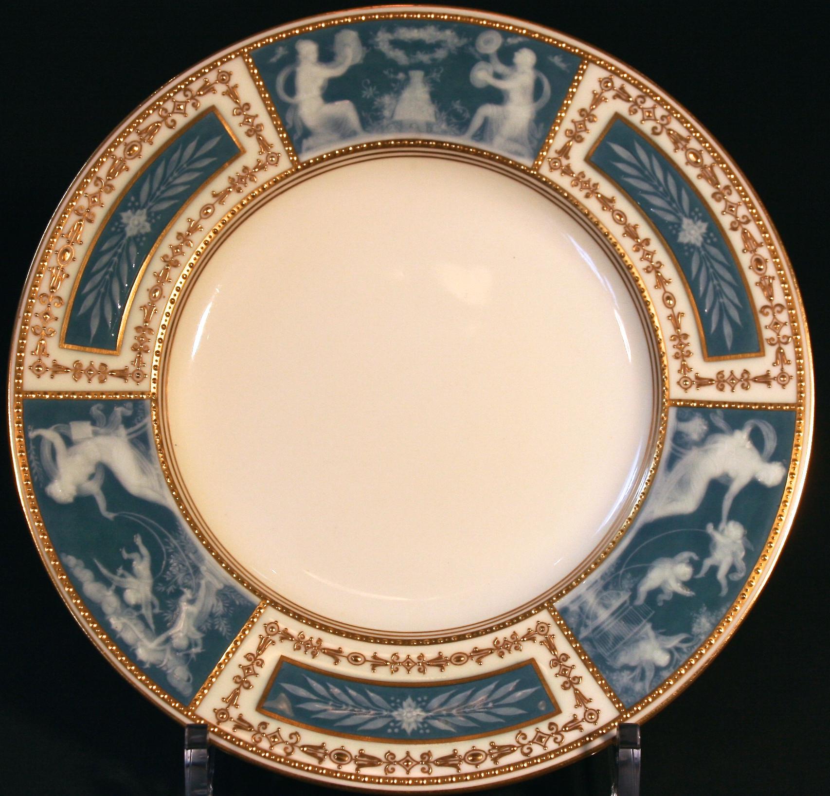 Here a set of 8 Tiffany blue Minton, Stoke-on-Trent, England pate-sur-pate service, cabinet or dinner plates in one of the most sought after of the pate-sur-pate designs. Each is decorated with three 22-karat gold beaded panels depicting Venus,