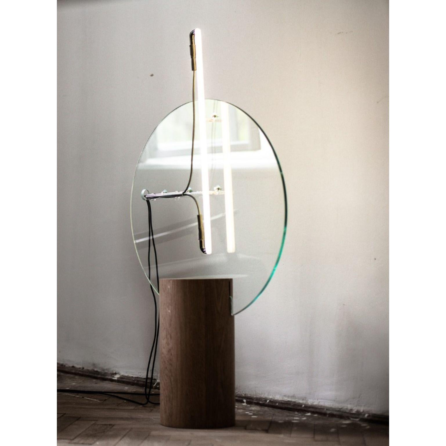 8 Minutes round by Radu Abraham
Materials: oak wood, glass, custom made light tube
Dimensions: 60 x 20 x 90 cm

All our lamps can be wired according to each country. If sold to the USA it will be wired for the USA for instance.

The base is