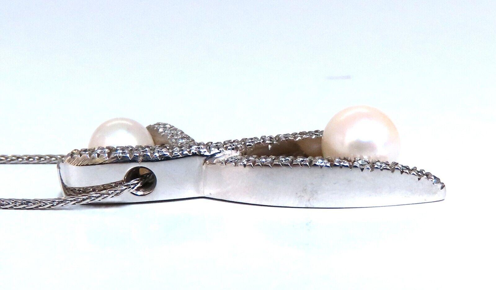 8 mm natural South Sea Pearl necklace.

Smaller Pearl 6.5 mm

.75 carat natural round diamonds

H color vs2 clarity

18 karat white gold pendant.

Chain measures 18 in long

14 karat white gold.

Pendant measures 38x12 mm

Depth: 5mm

Total weight