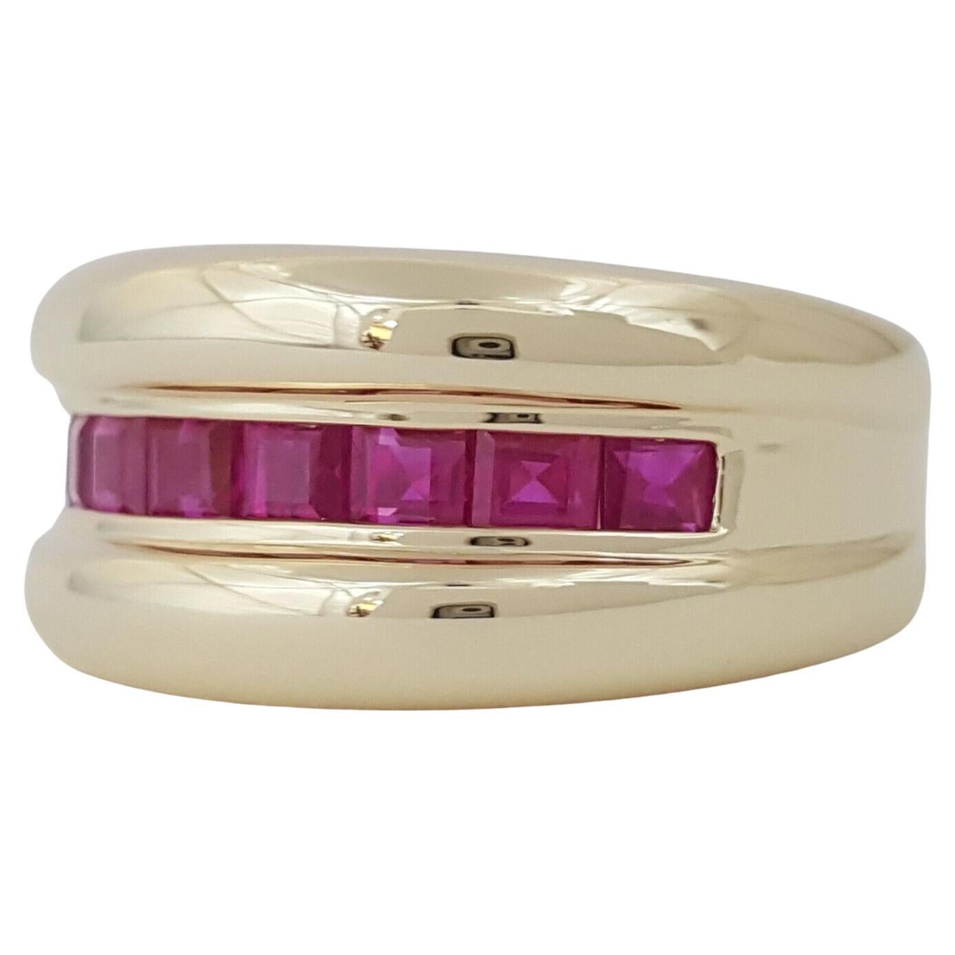 This 14k Yellow Gold ring, weighing 6.7 grams and sized at 6.25, boasts 8 Natural Square Shaped Red Rubies, totaling approximately 1.2 carats, in a Princess Cut Channel Setting, perfect for weddings or making a bold statement.