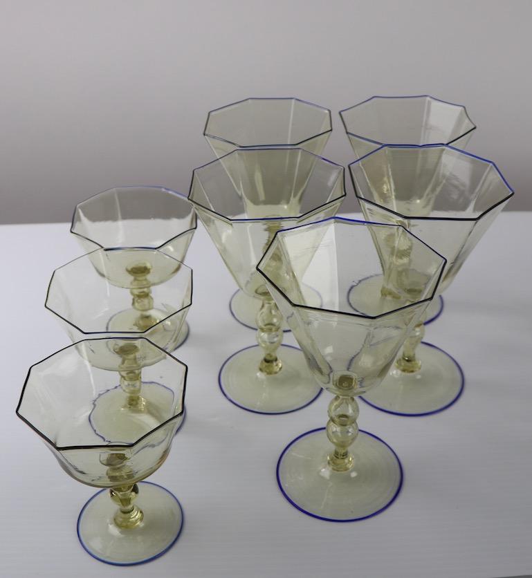 Graceful and elegant Venetian Stemware by Salviati, 8 pieces, 5 larger wine glasses, and 3 champagne glasses. All are in perfect condition, free of damage or repairs. Offered and priced as one lot, 8 pcs included in lot. The wine glasses are all the