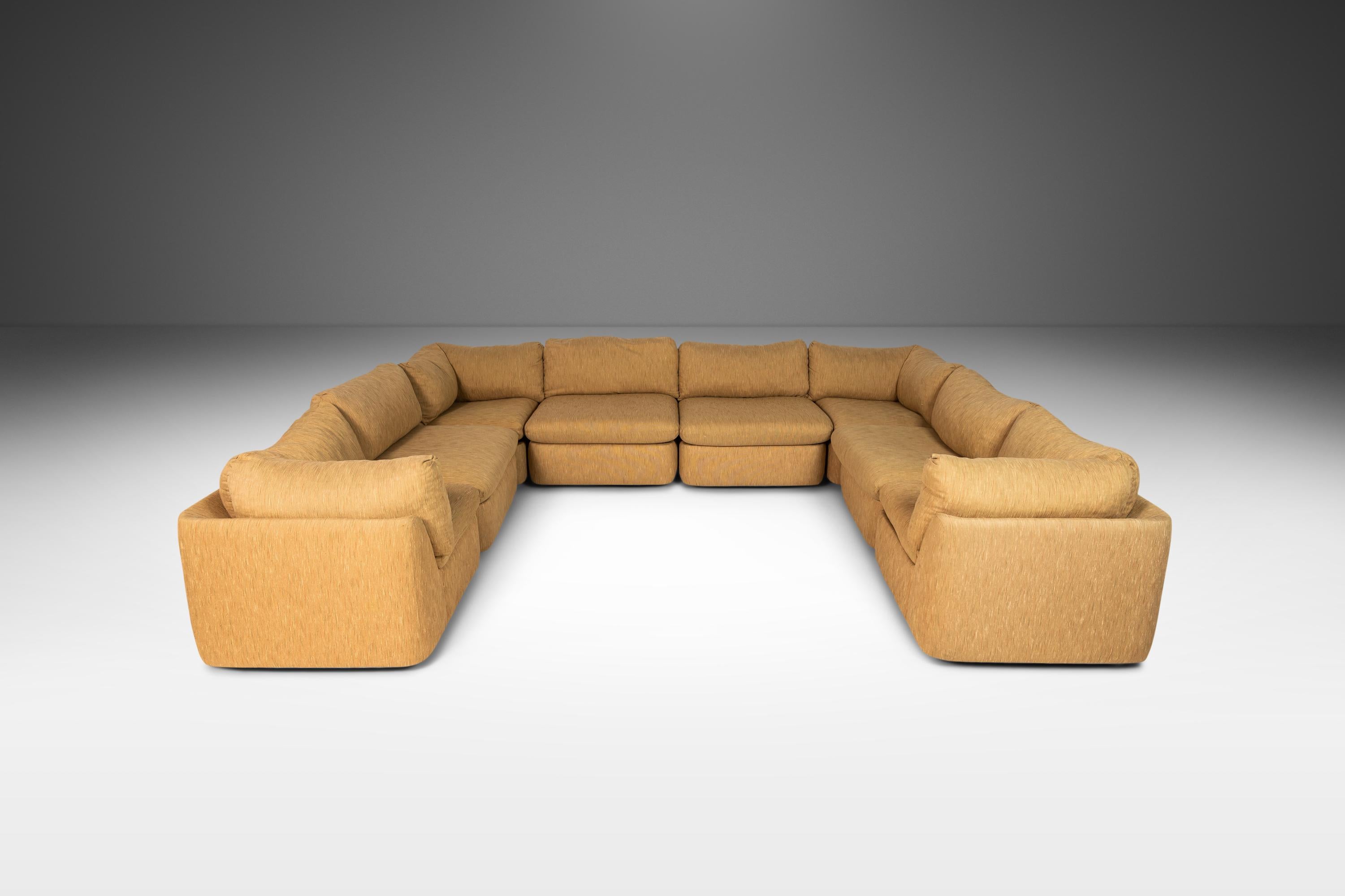 Consisting of eight pieces (four corner pieces and four side pieces) this expansive sectional sofa is as comfortable as it is grand in scope. Able to be arranged in an almost limitless amount of positions and shapes this sofa is ideal for those