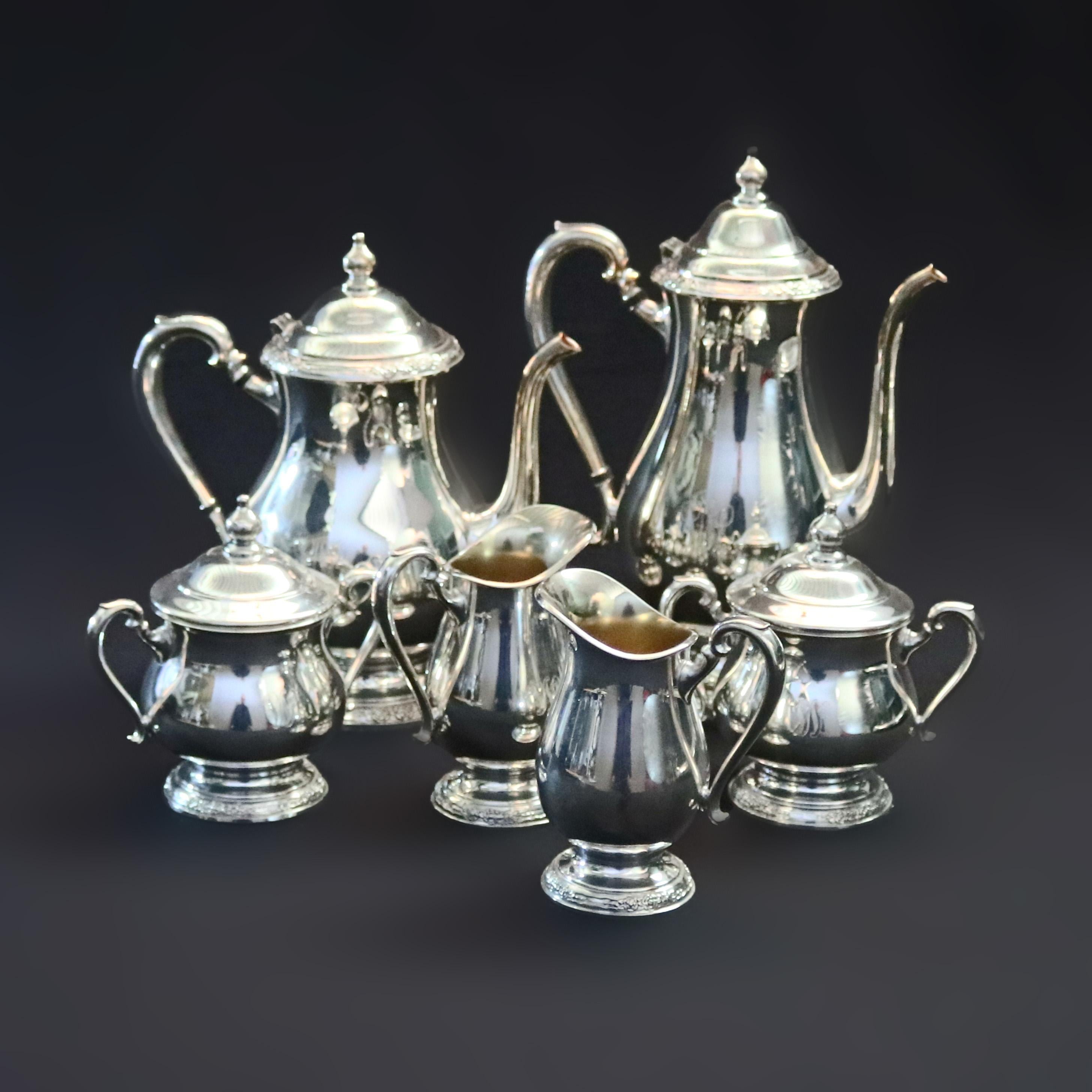 An eight-piece silver plate coffee and tea service offers bulbous form with footed bases with 