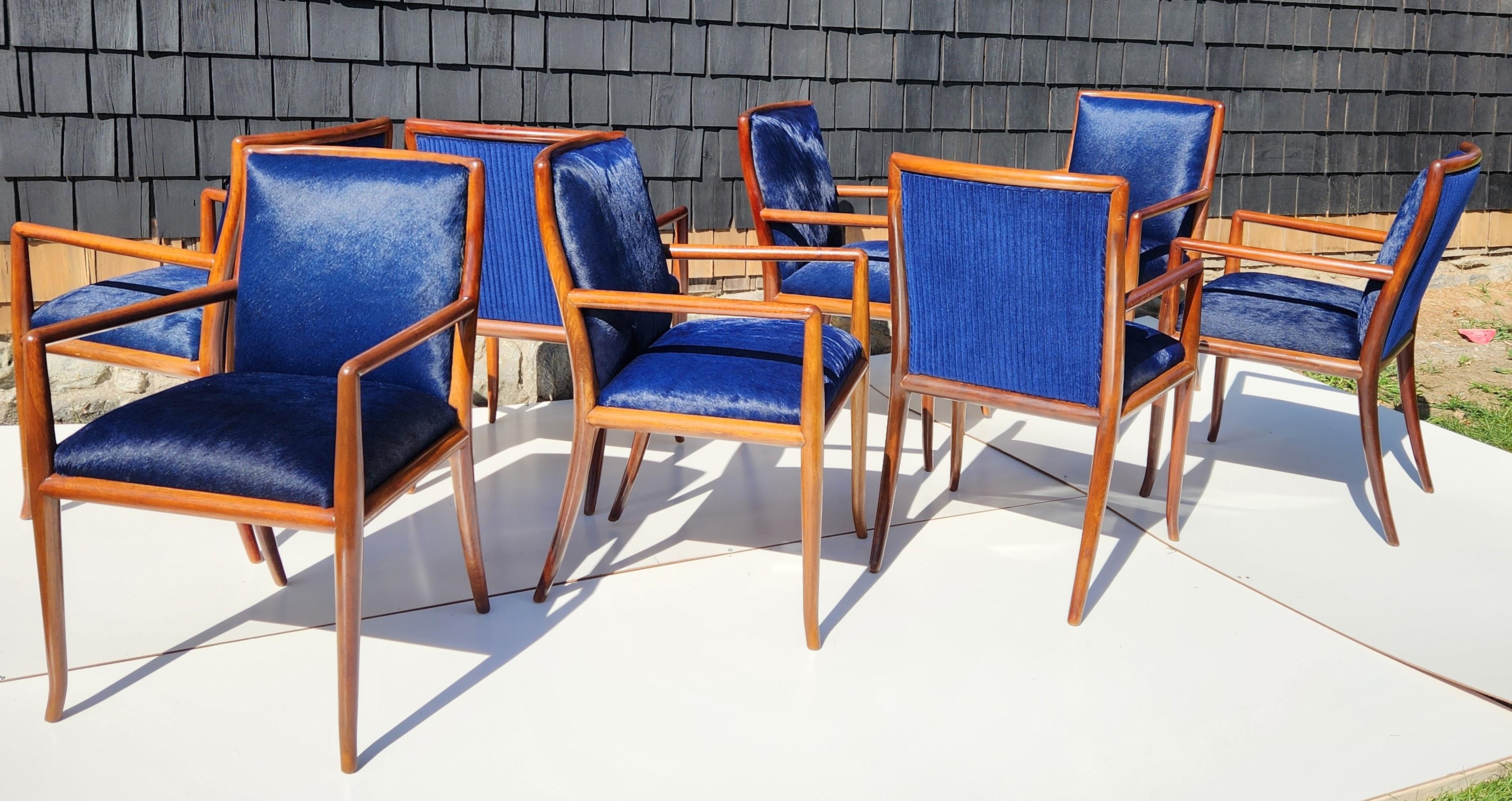 A great set eight of T. H. Robsjohn-Gibbings sculptural walnut armchairs for Widdicomb originally purchased in 1959.
The chairs are in excellent condition newly upholstered in cobalt blue leather with matching cobalt blue ribbed velvet backs.
The