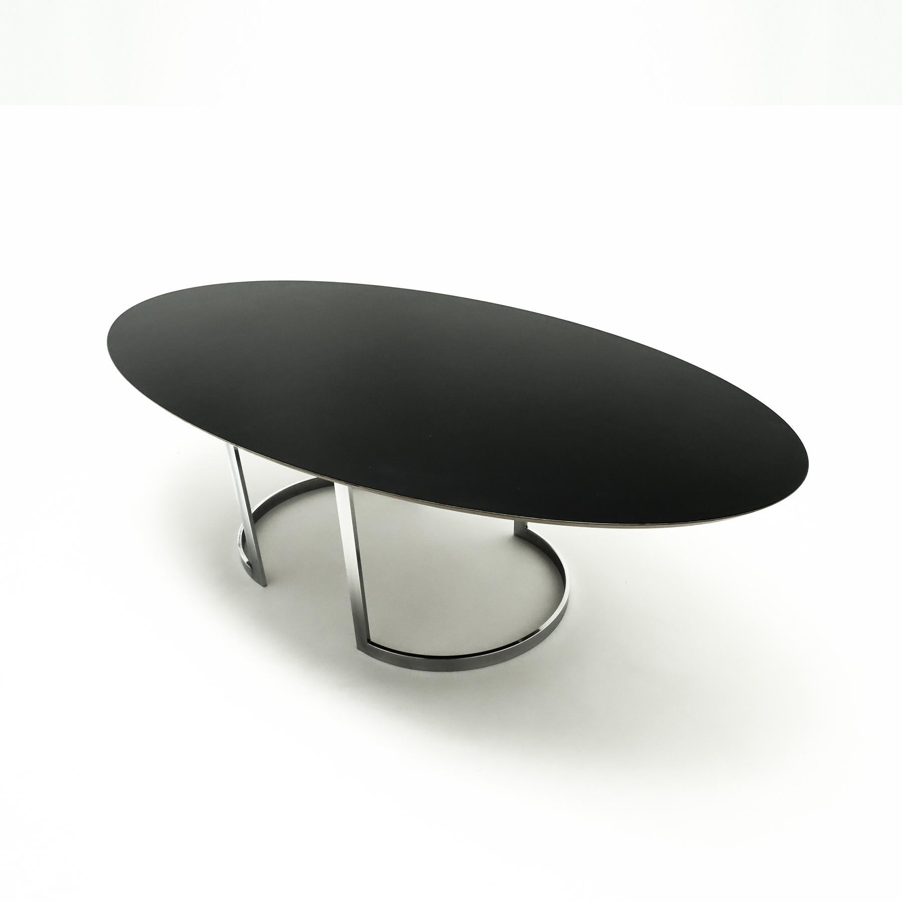 Large black and chrome 8 seat office meeting room, or conference room table in the style of Milo Baughman.

This large oval table is constructed from thick plywood that features a pressure treated black melamine top sat on two chrome bases. The