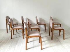 8 wood and fabric dining chairs, 1960s Italian prod