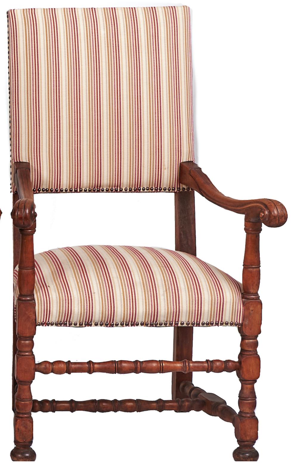 A fine set of eight fruitwood chairs, late 19th century, in the Louis XIV style.

Just purchased, the set including four armchairs with scroll arms, all on baluster-and-block legs united by similarly turned stretchers. The modern stripe upholstery