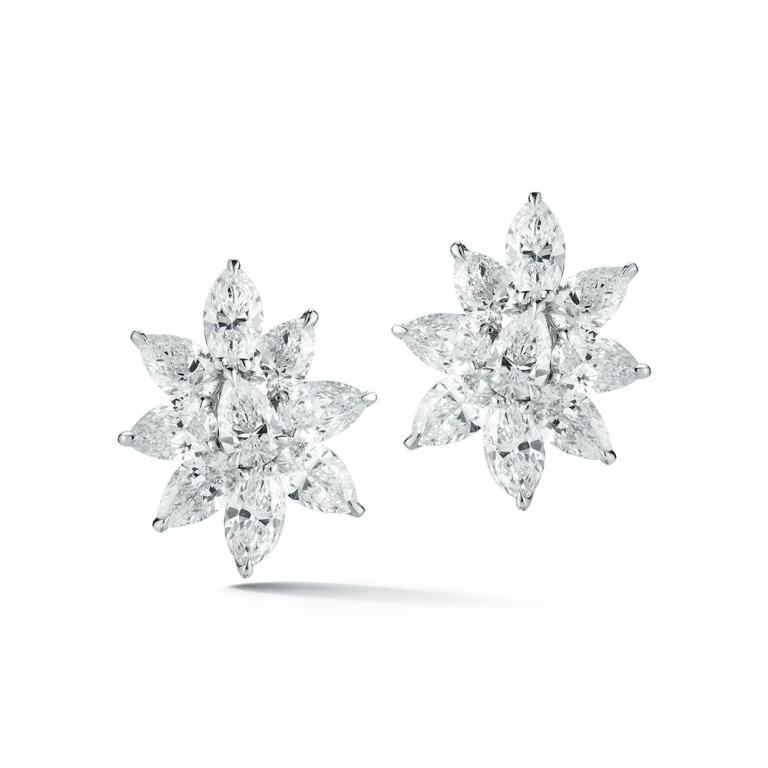 8 STAR DIAMOND CLUSTER EARRINGS Eighteen marquise and pear shaped diamonds make these earrings look splendid in this classic platinum setting Item: # 03110 Metal: Platinum Diamond Weight: 7.81 ct.
