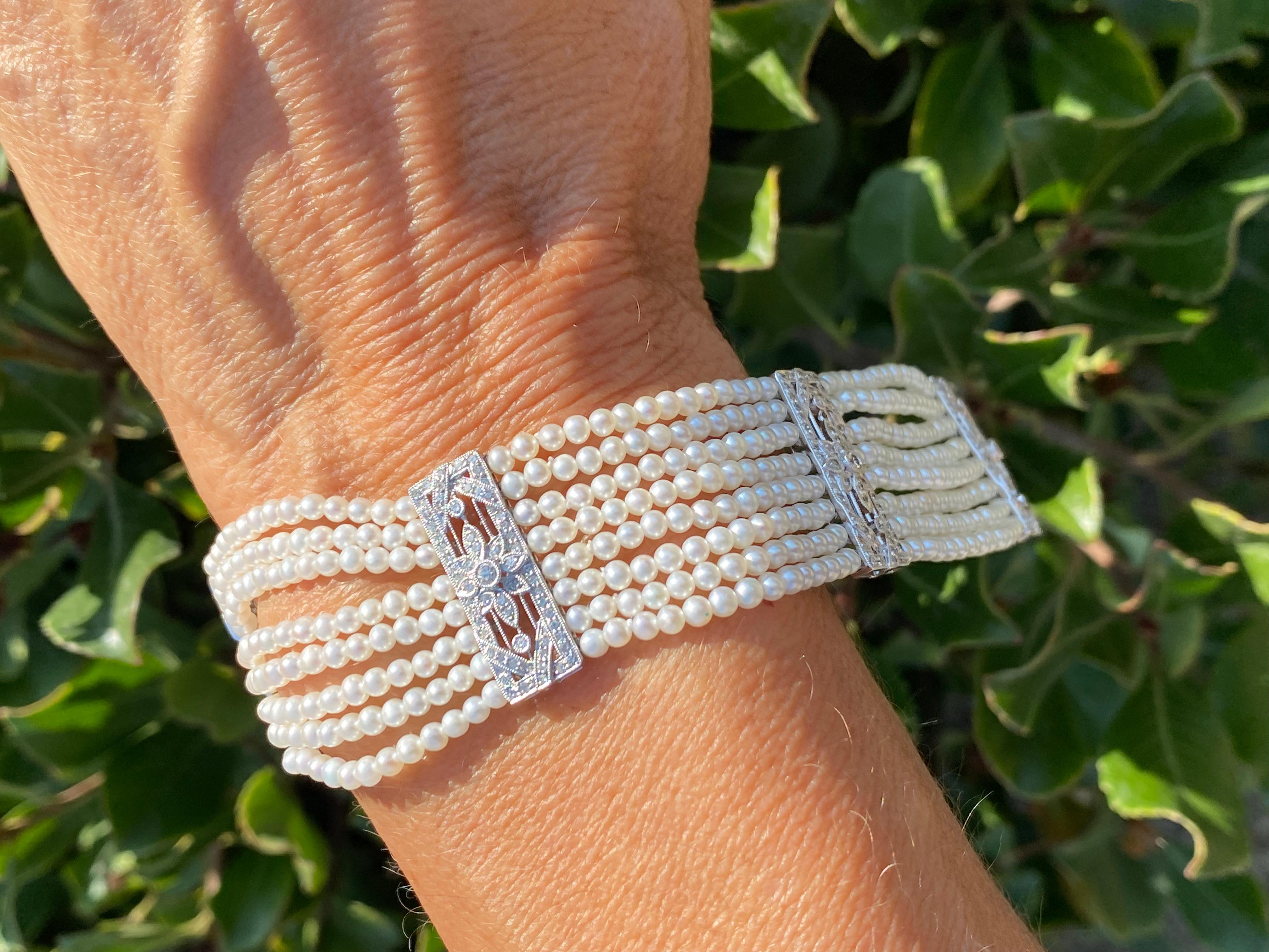 8 Strand Pearl and Diamond Bracelet

This spectacular platinum and diamond pearl bracelet is made with the finest AAA pearls and diamonds

Eight strands of perfectly matched pearls measure 2.5 mm each and are attached by four Ornate diamond