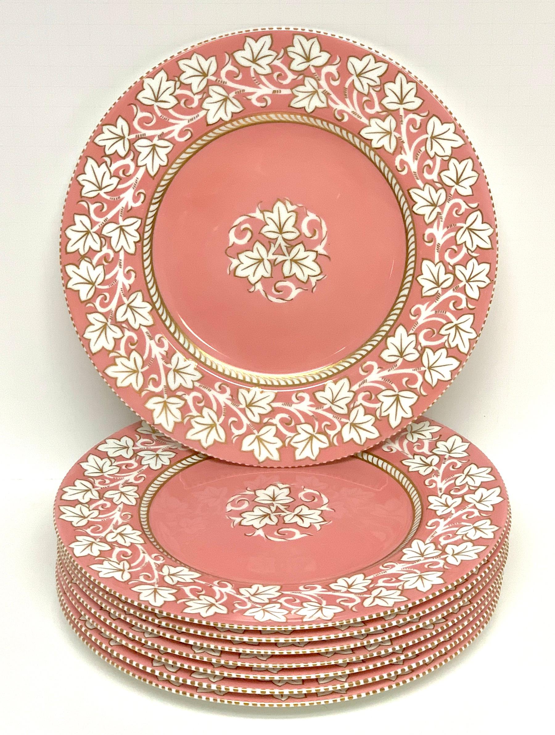 8 stunning Hollywood Regency Wedgwood pink Lustre service plates, each one vibrant pink background with continuous leaf decoration. Each one marked Wedgwood, Made in England, with painters marks.