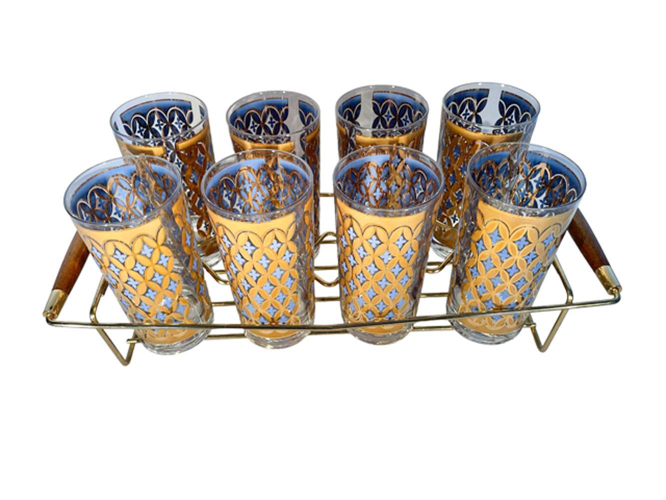 Eight Irene Pasinski designed highball glasses with high-gloss and satin finished overlapping 22 karat gold oval links with blue enamel four petaled flowers in the openings. On the interior the satin gold part of the design is covered by blue