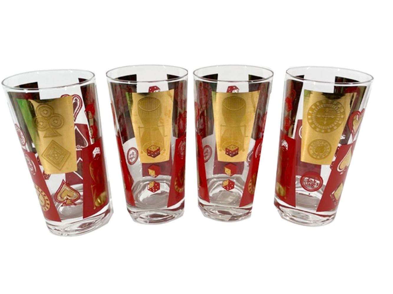 Mid-Century Modern highball glasses with casino / gambling motifs, including card suits, roulette wheels, dice and poker chips in red enamel and 22 karat gold on clear glass.