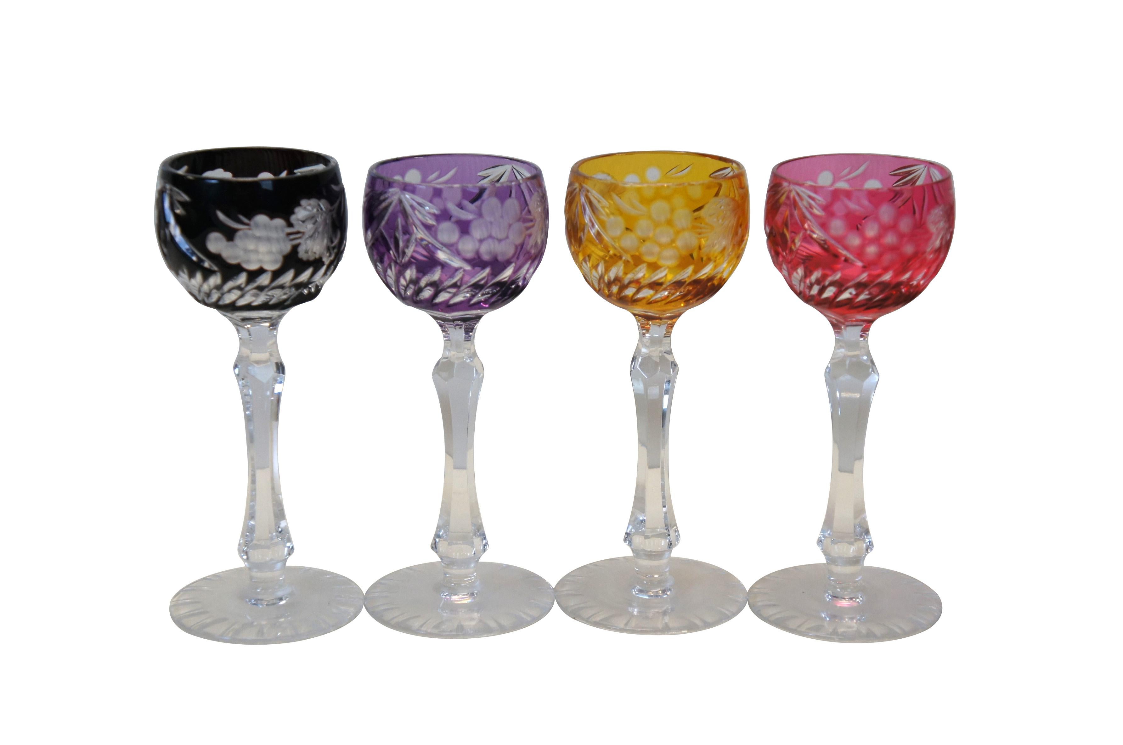 Set of 8 mid to late 20th century cut to clear Bohemian / Czech crystal cordial glasses. Married together from several different original sets. Clear stems and bases with colored tops - cranberry pink, black, cobalt blue, yellow, and amethyst