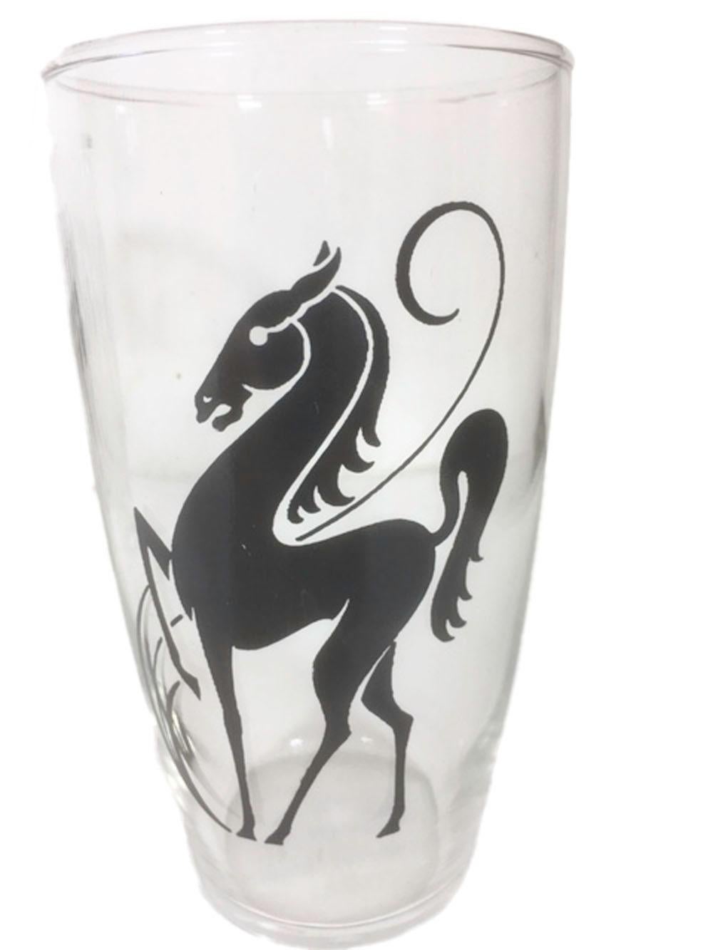 Set of 8 vintage tumblers, decorated in black enamel with an image of a stylized prancing horse on clear glass.