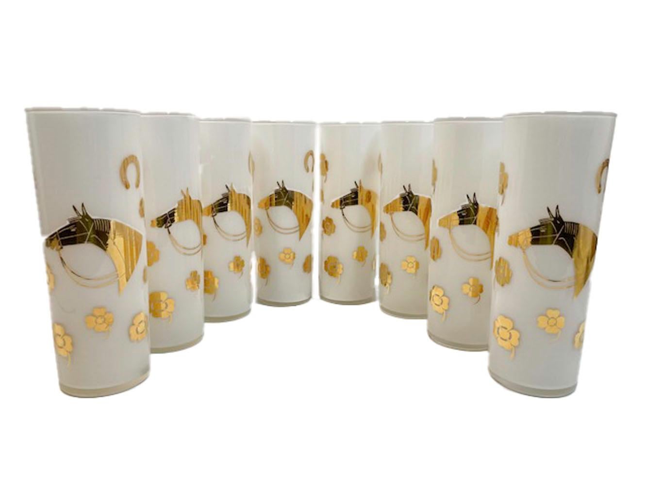 Mid-Century Modern Tom Collins glasses designed by Fred Press in the Derby Time pattern. Clear glass with white frosted interiors and decorated on the exterior in 22 karat gold with the profile of the head of a thoroughbred race horse on one side