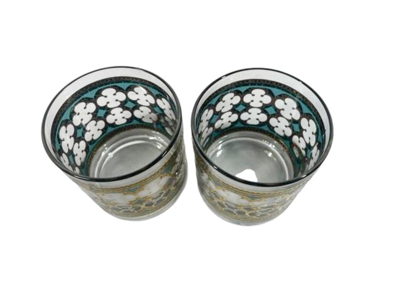 Set of eight Washington Glass vintage rocks glasses with an allover pattern of quatrefoils in 22k gold over translucent teal enamel.