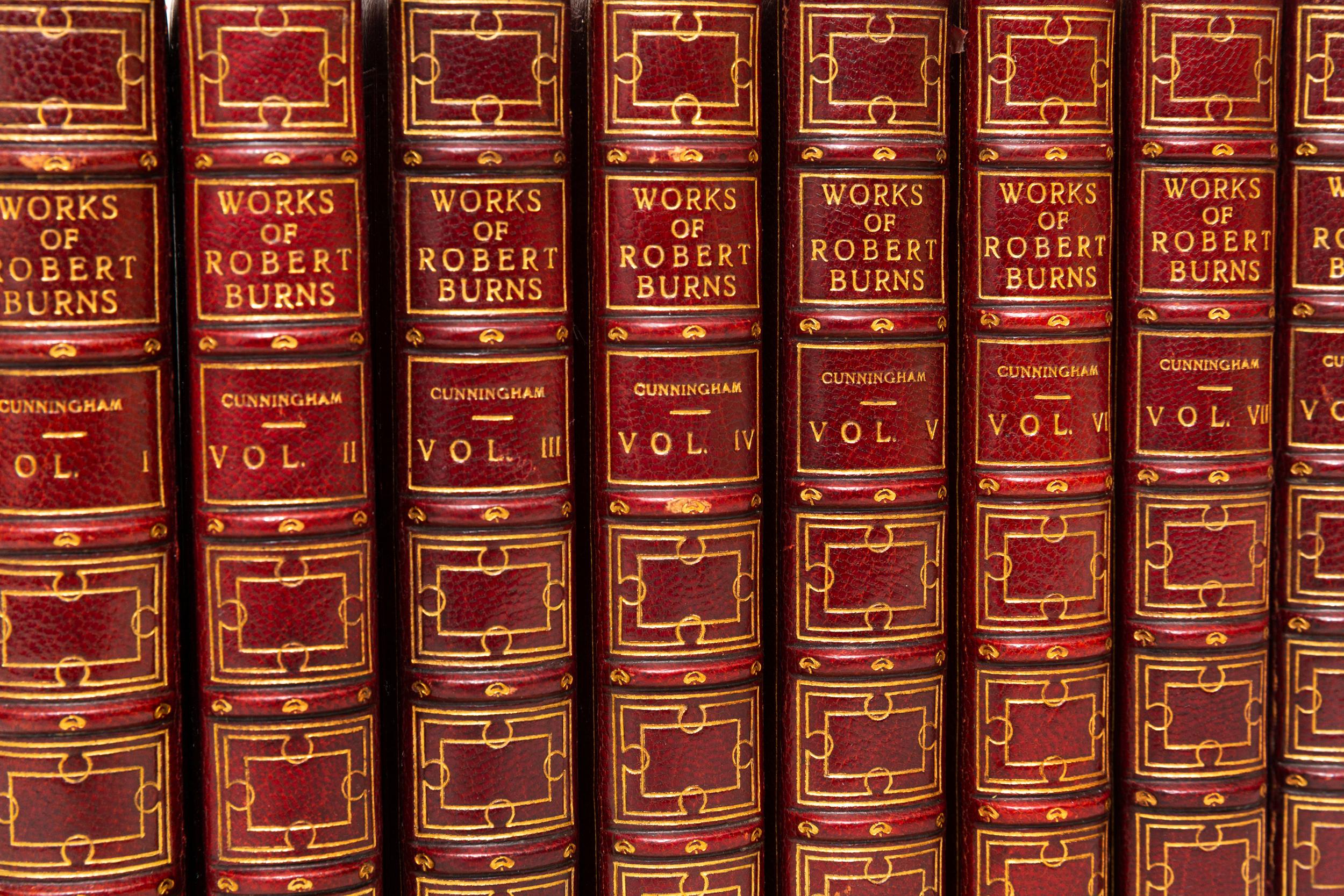 8 Volumes. Robert Burns, The Works of Robert Burns. Bound in full red morocco. Decorative gilt-tooling on covers. Raised bands. Silk endpapers. Bound by Bayntun. Illustrated. All edges gilt. Published: London; Cochrane & M'Crone, Waterloo Place 1834