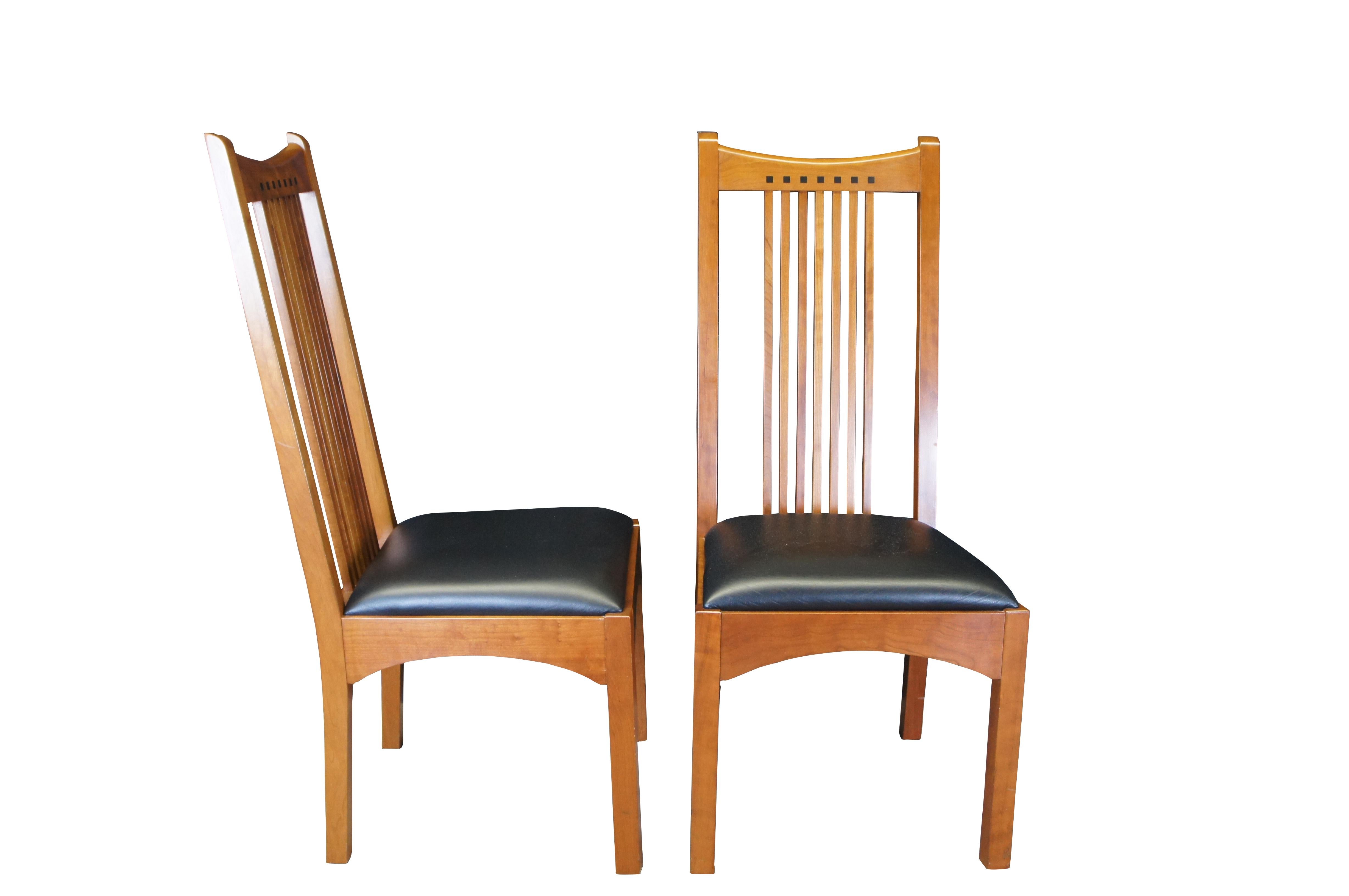 Set of eight vintage Stickley 21st Century Collection dining side chairs.  Made of cherry featuring traditional mission styling with slatted backs, mortise and tenon construction, leather seats and Ebony inlays.  Circa May 29, 1998 Manlius New