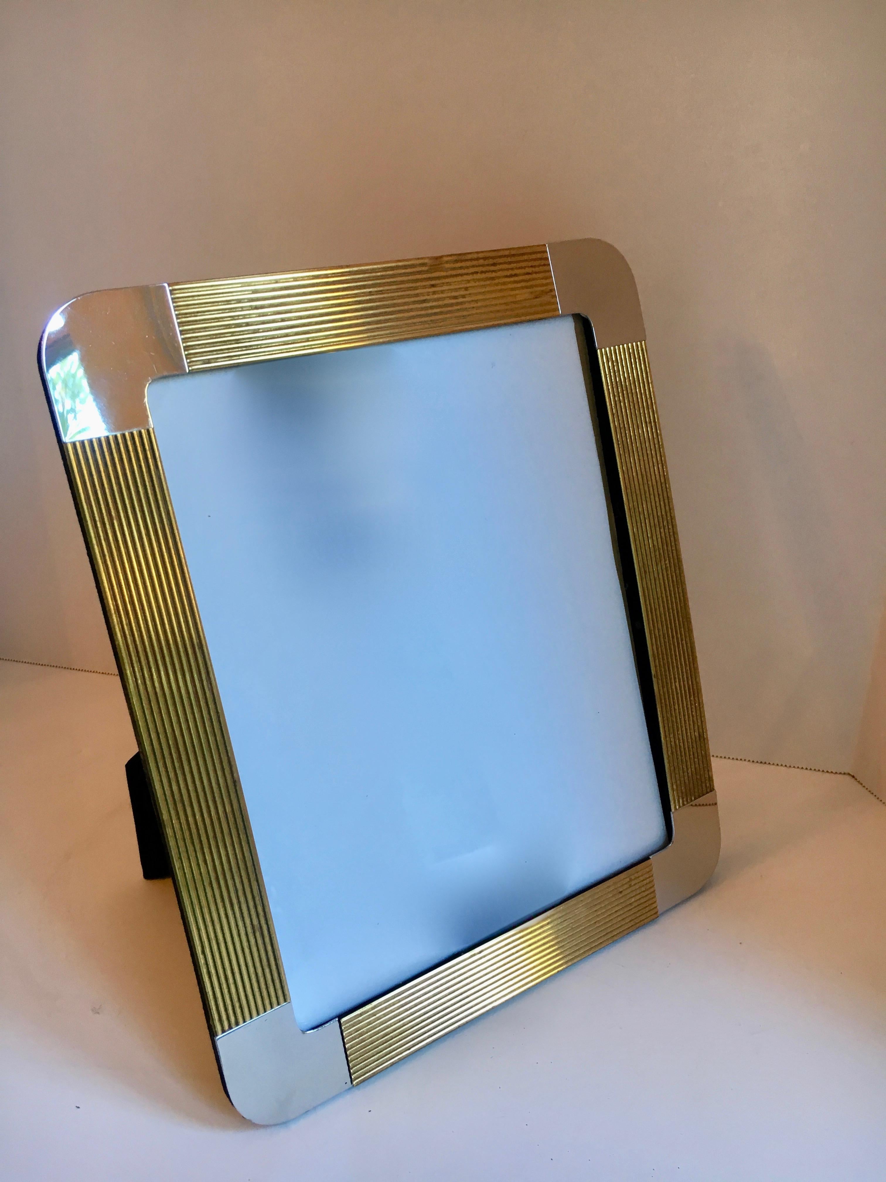 8 x 10 brass and chrome picture frame - holding memories in style. A stylish frame with black velvet reverse.