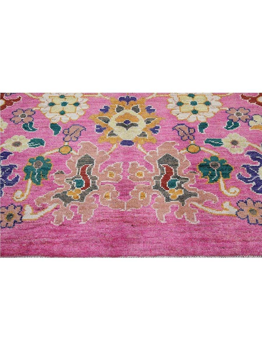Transform your space into a dreamy oasis with this Barbie pink 8x11 Persian Sultanabad Rug - the perfect rug to adorn your own dream house. The pink hue serves as a captivating backdrop to accents of gold, light blue, green, and navy.
Handknotted